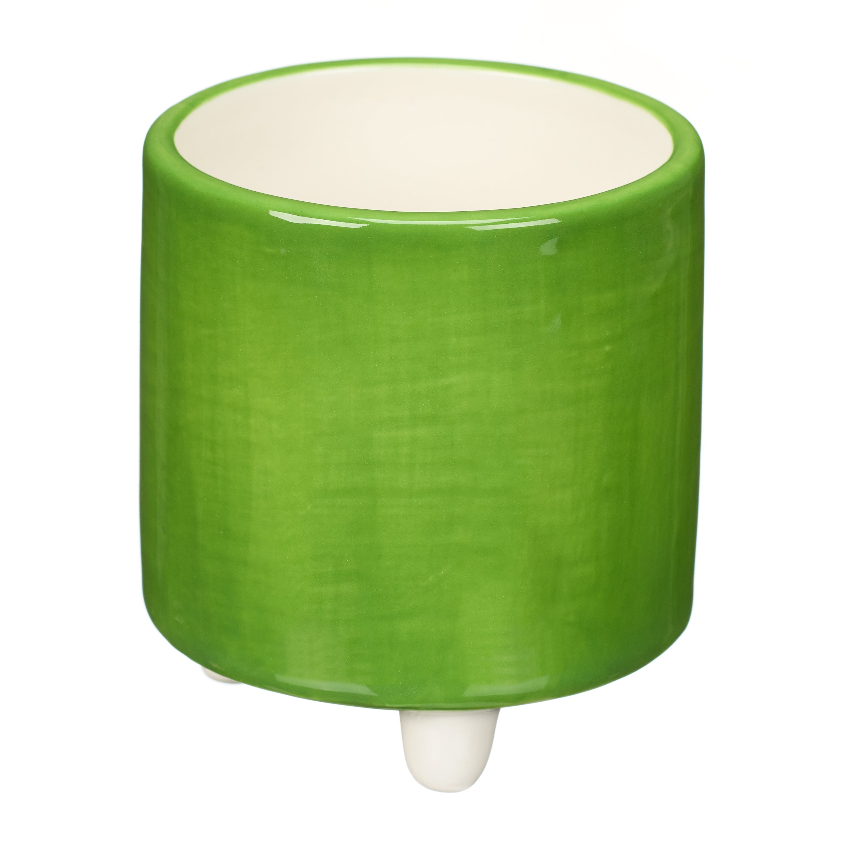 Green ceramic pot with a creamy white interior and three small, white feet.