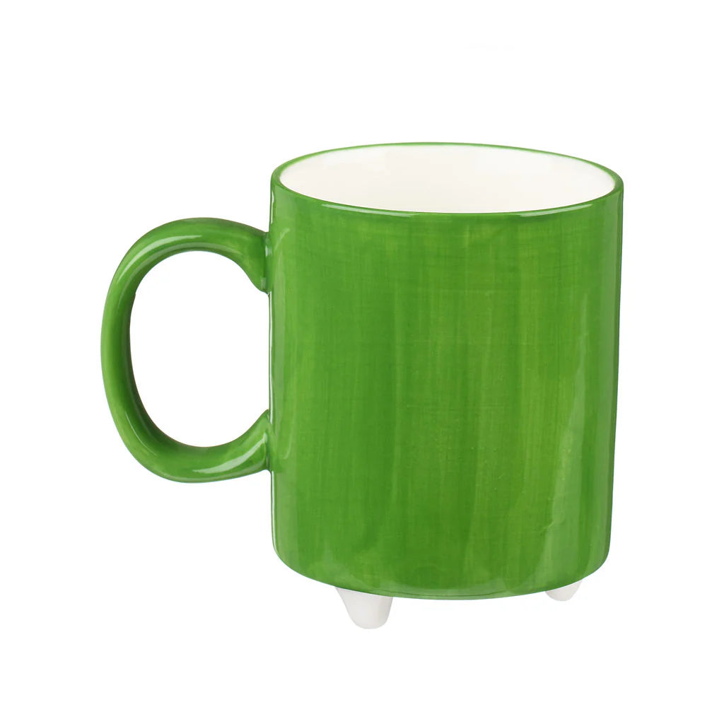 Bright green ceramic mug with a white interior and three small white feet.