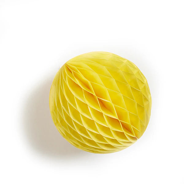 Yellow honeycomb paper ball decoration.
