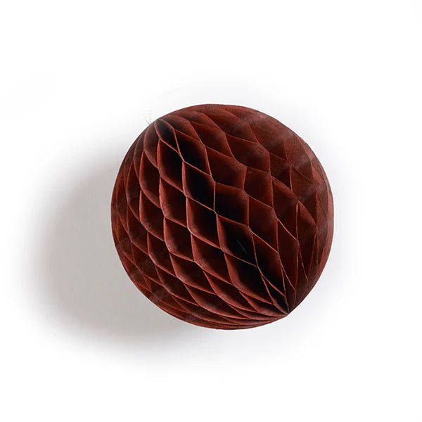 Dark red honeycomb paper ball decoration. The ball has a textured surface with a repeating diamond pattern.