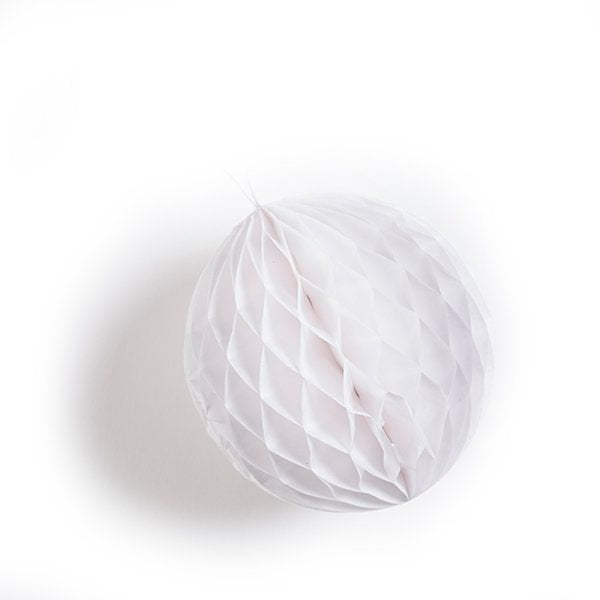 Off-white honeycomb paper ball decoration.