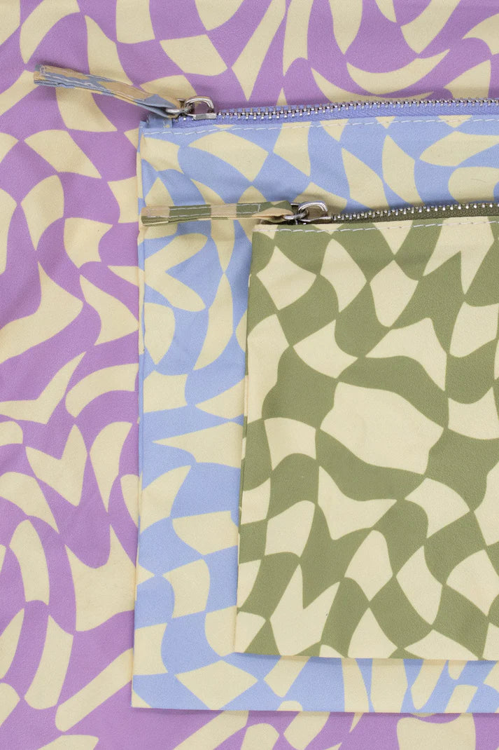 Three zippered pouches in lavender, light blue, and olive green.