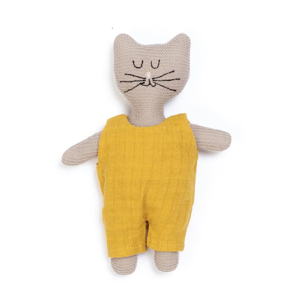 Knitted cat toy wearing a mustard yellow jumpsuit.