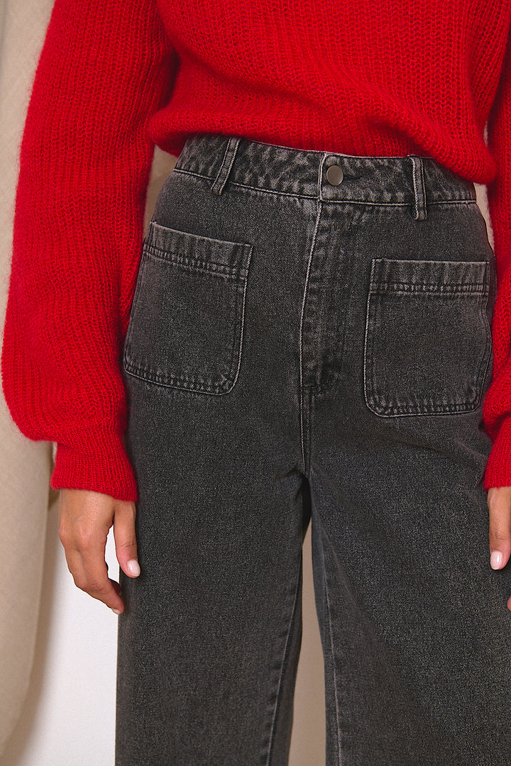 Dark gray high-waisted jeans with front patch pockets.