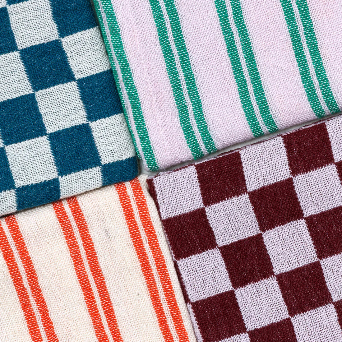 Four different fabric patterns arranged in a grid.