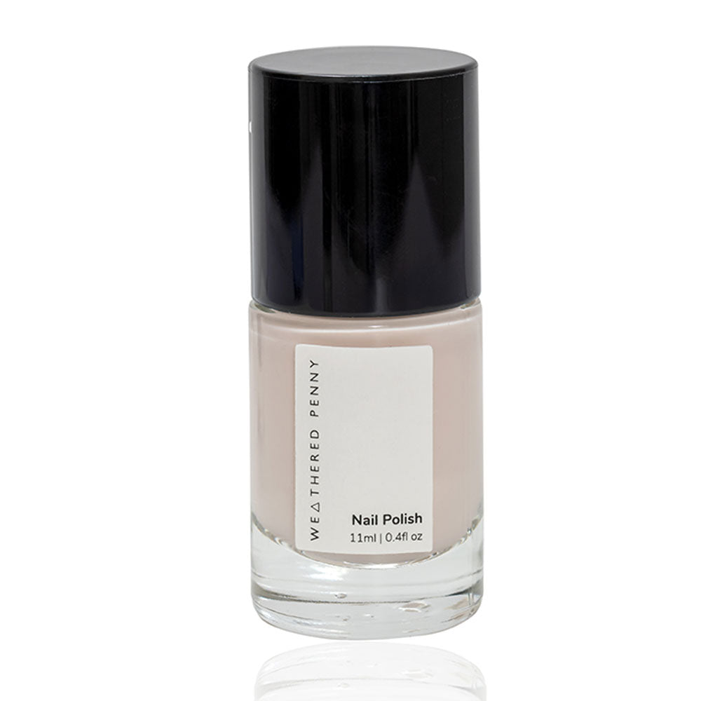 Weathered Penny nail polish in a light beige shade, 11ml bottle with a black cap.