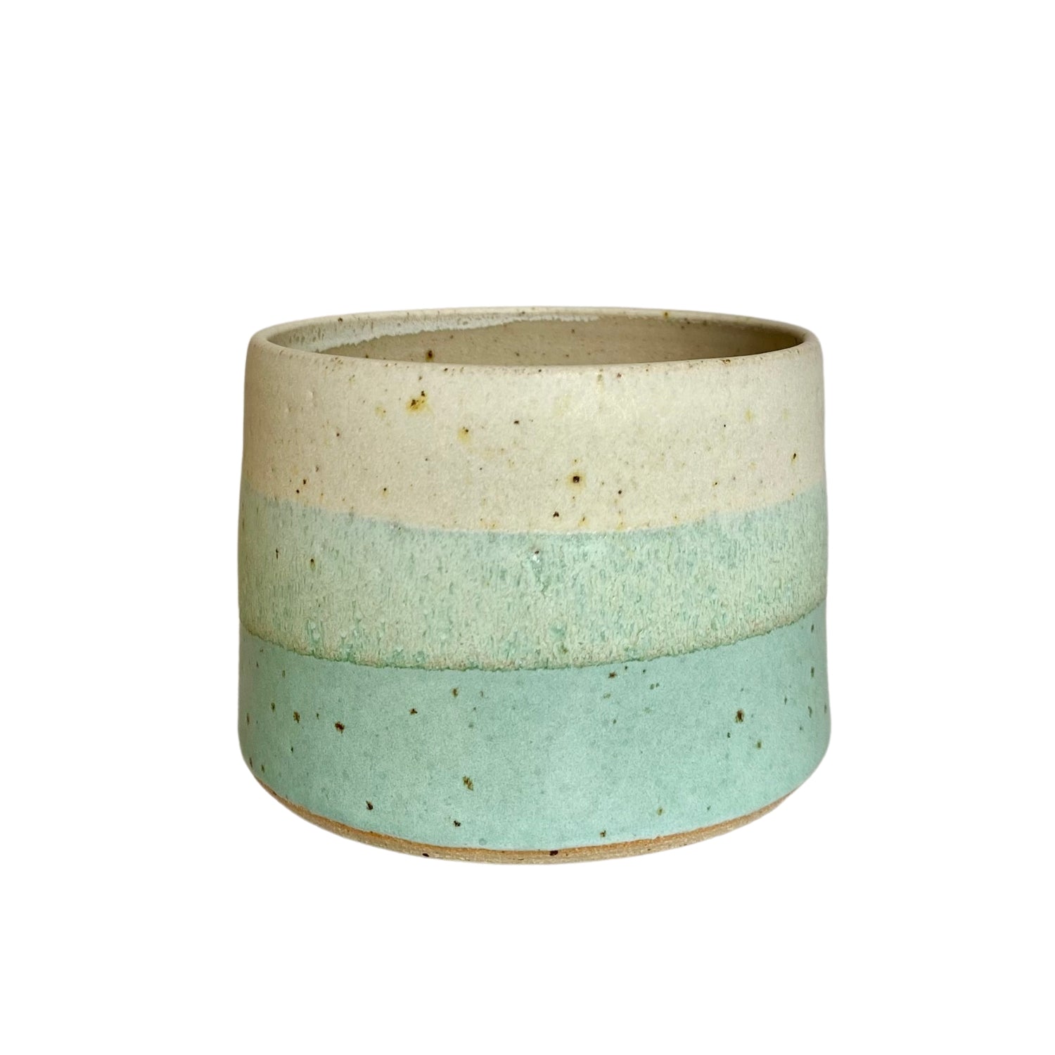 Ceramic bowl with off-white, light green, and seafoam green horizontal bands.  Speckled texture throughout.