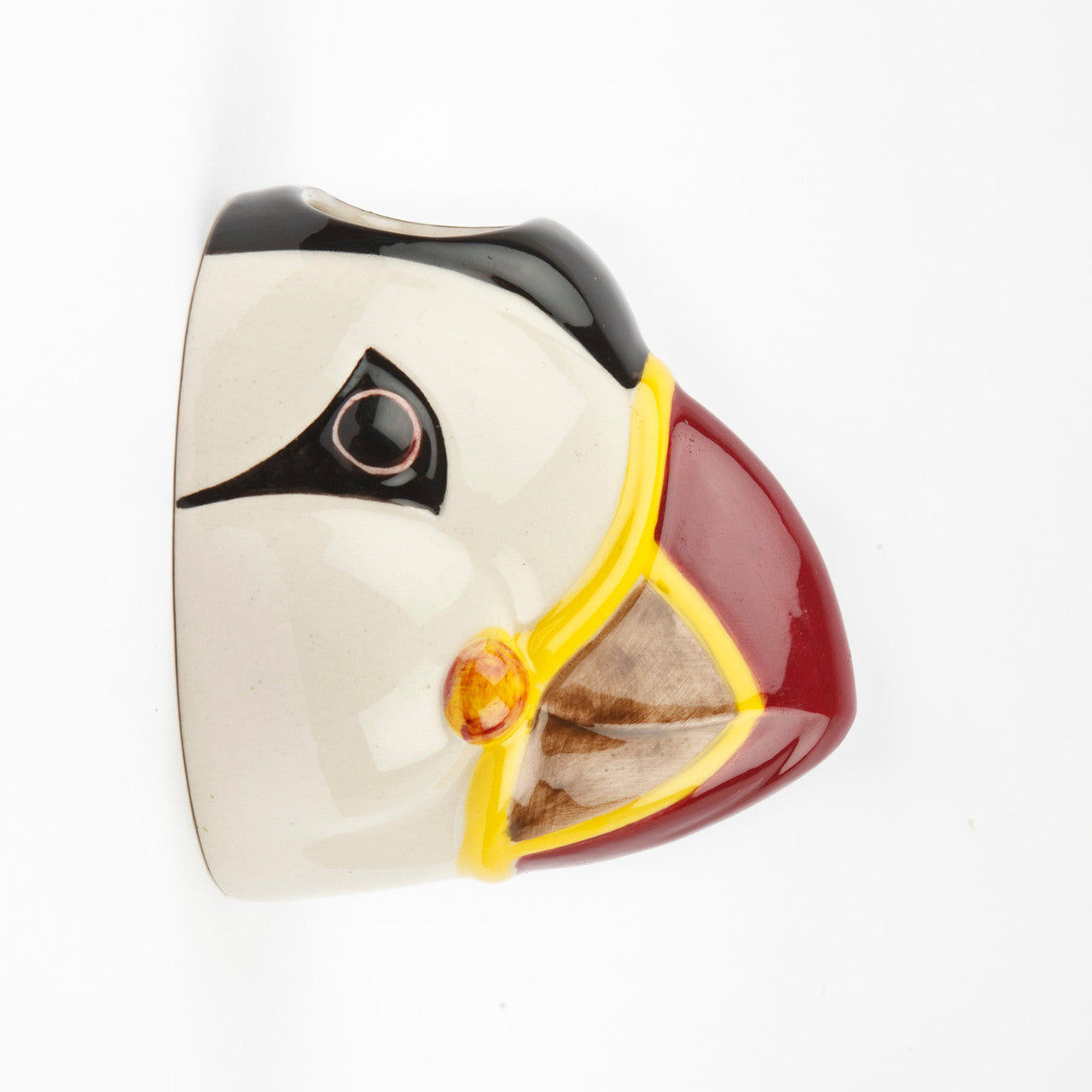 Ceramic puffin wall hanging.  Hand-painted with white, black, red, yellow, and brown details.