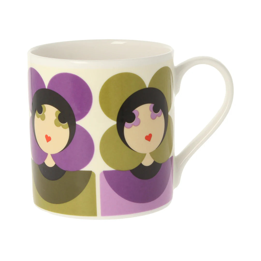 Mug with decorative design of faces on a white background