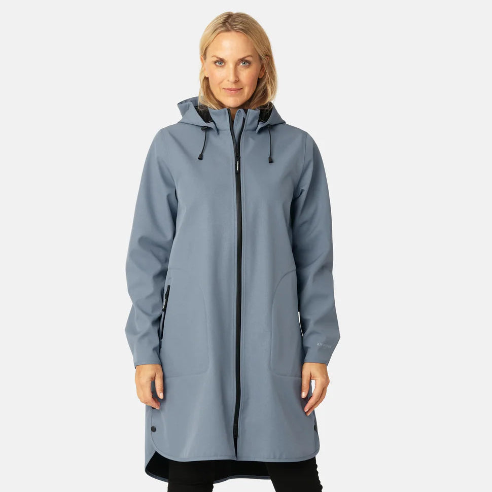 Woman wearing a long gray coat on a white background