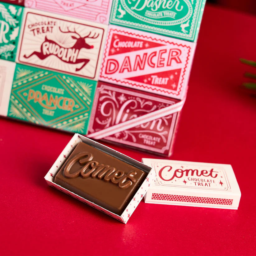 Milk chocolate bar shaped like a matchbox, imprinted with "Comet."