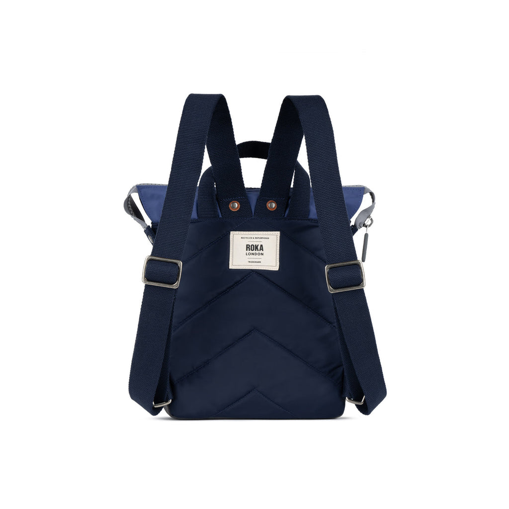 Navy blue backpack with visible brand label on a white background