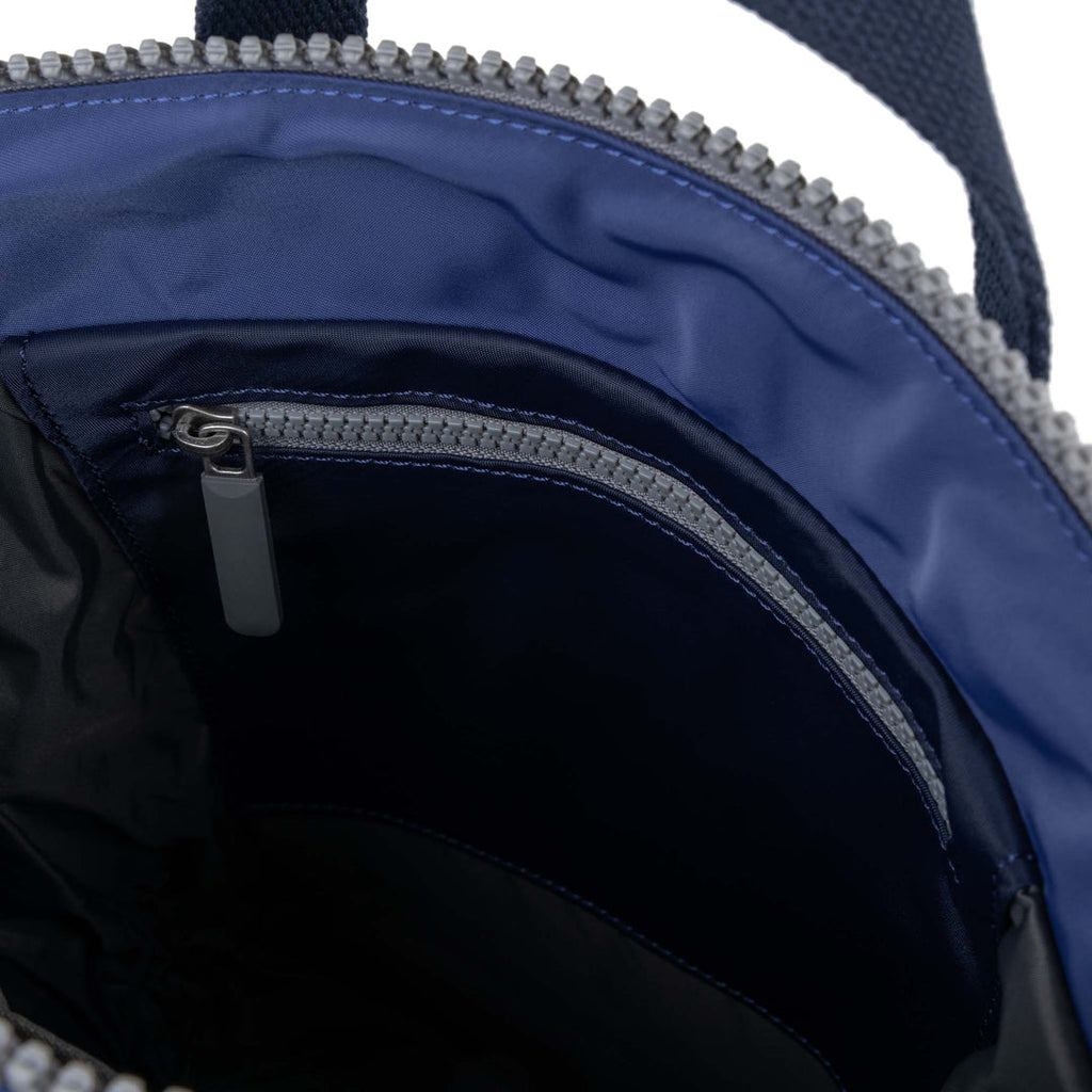 Close-up of a blue and black bag with a zipper