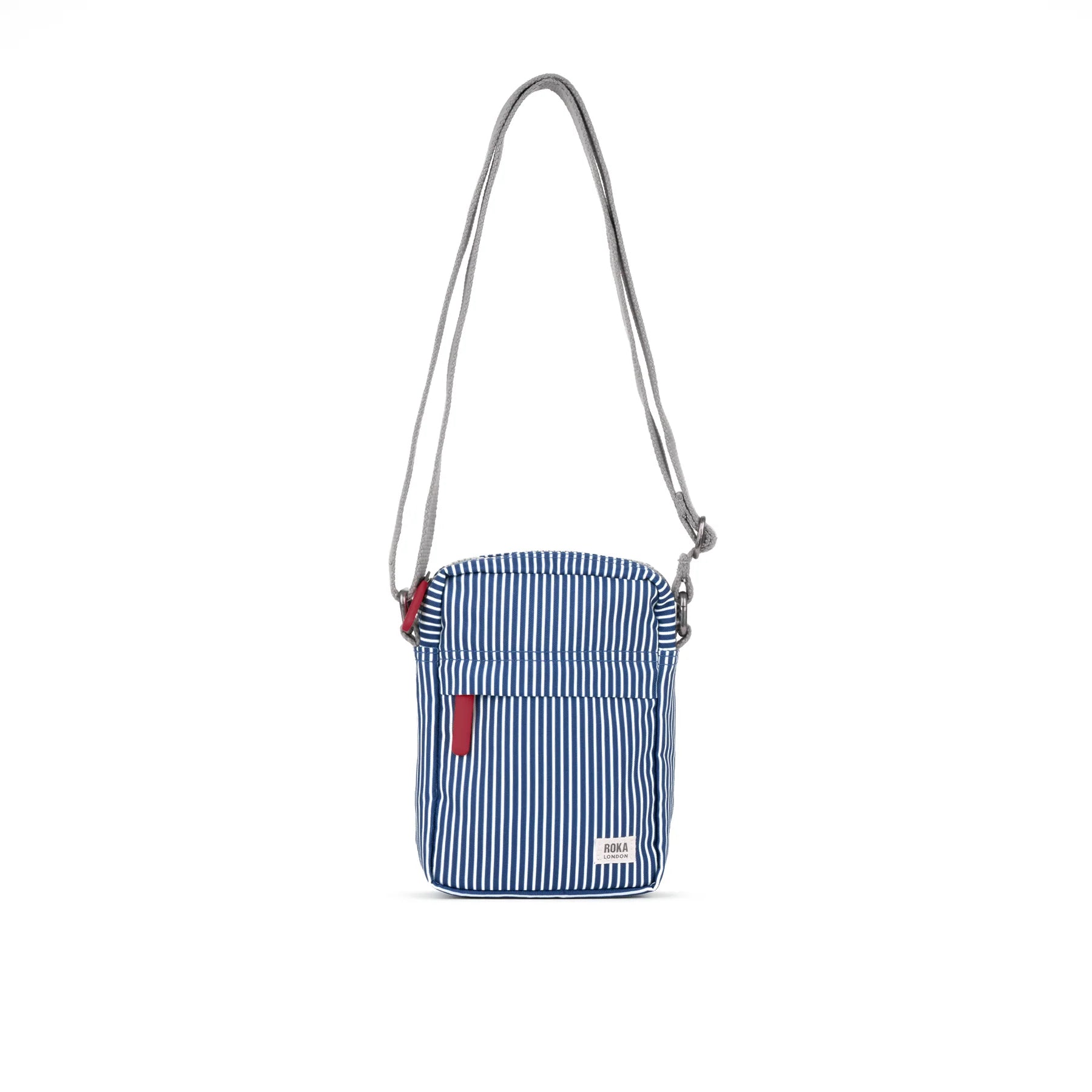 Blue and white striped crossbody bag with a red tag on a white background