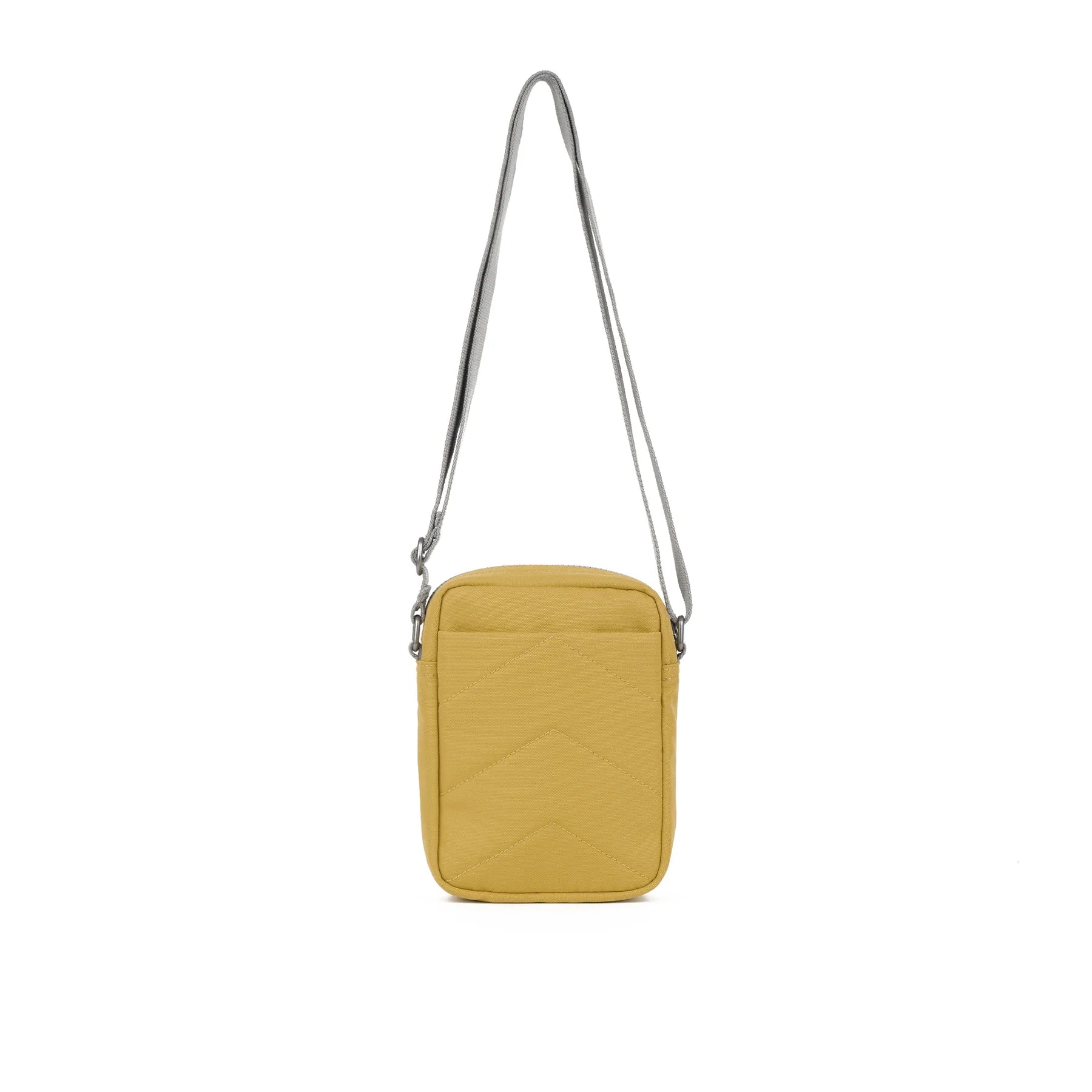 Mustard yellow quilted crossbody bag with gray shoulder strap.