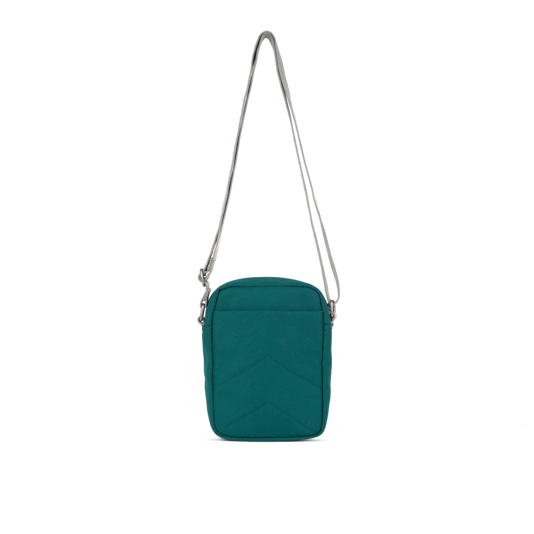 A teal Bond Pocket Crossbody bag made from recycled canvas with a zippered top, an extra external pocket, and an adjustable strap. It features a main compartment and an additional mesh pocket inside.