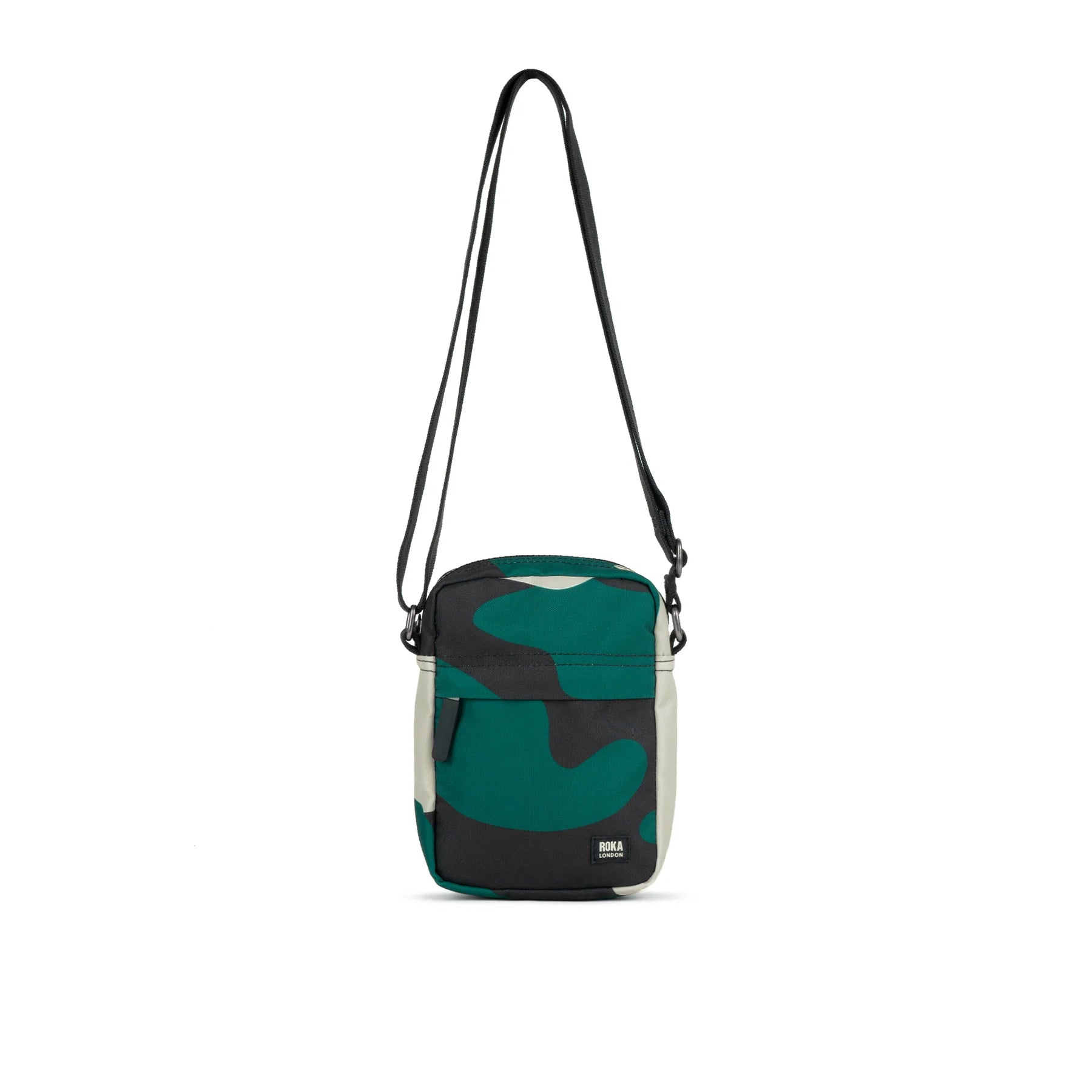 Small crossbody bag with adjustable shoulder strap. Features a teal, black, and off-white abstract camouflage pattern.