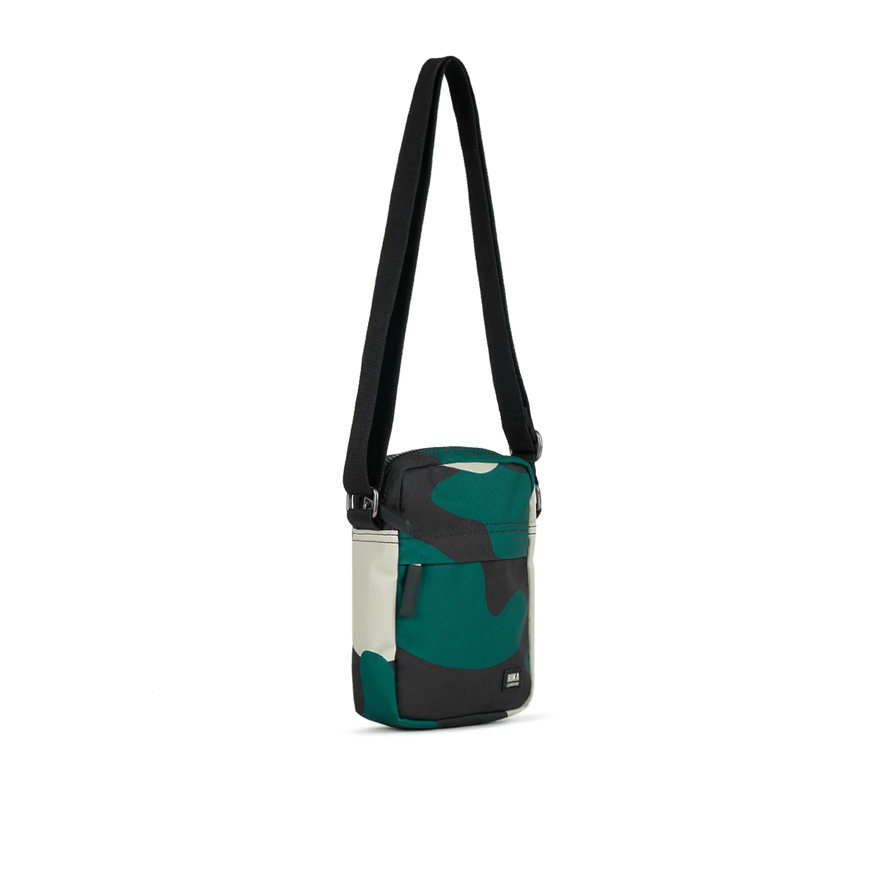 Small crossbody bag with adjustable shoulder strap. Features a teal, black, and off-white camouflage pattern.
