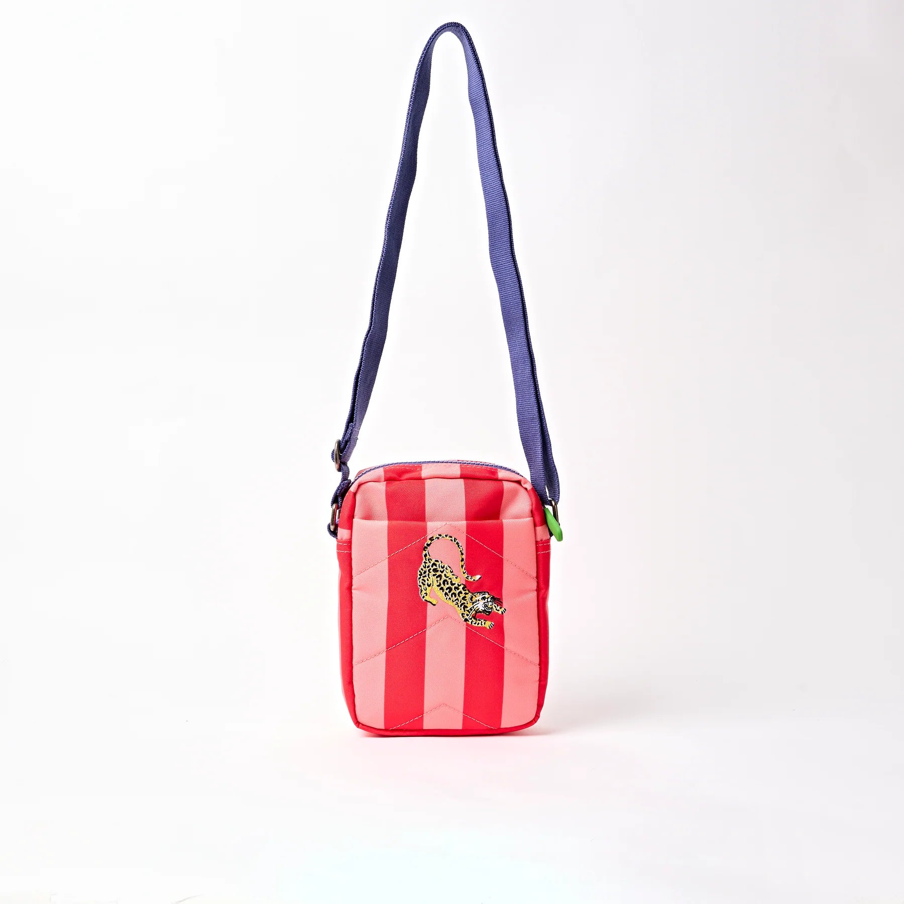 Red and white striped bag with a blue strap on a white background