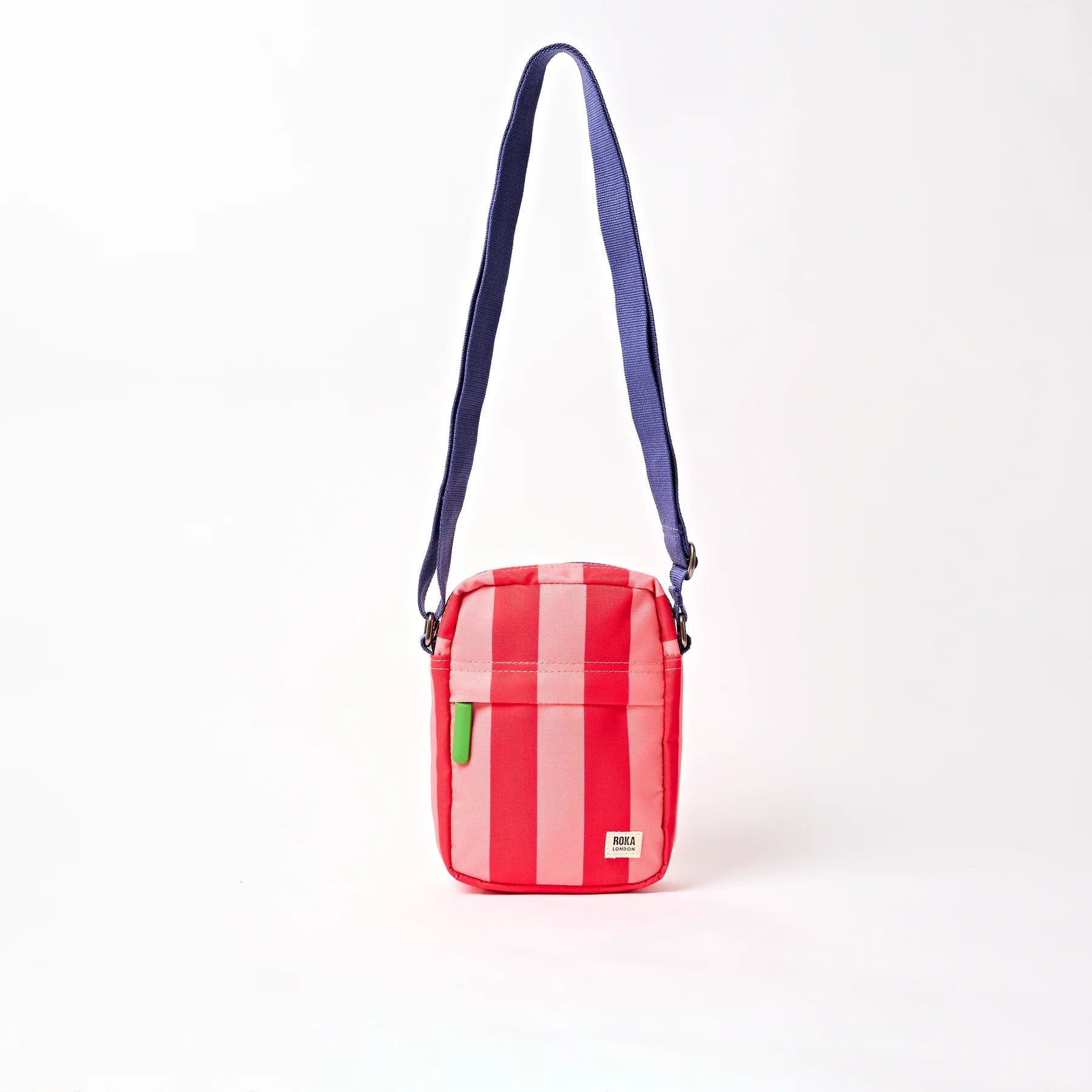 Red and white striped bag with a green tag on a white background