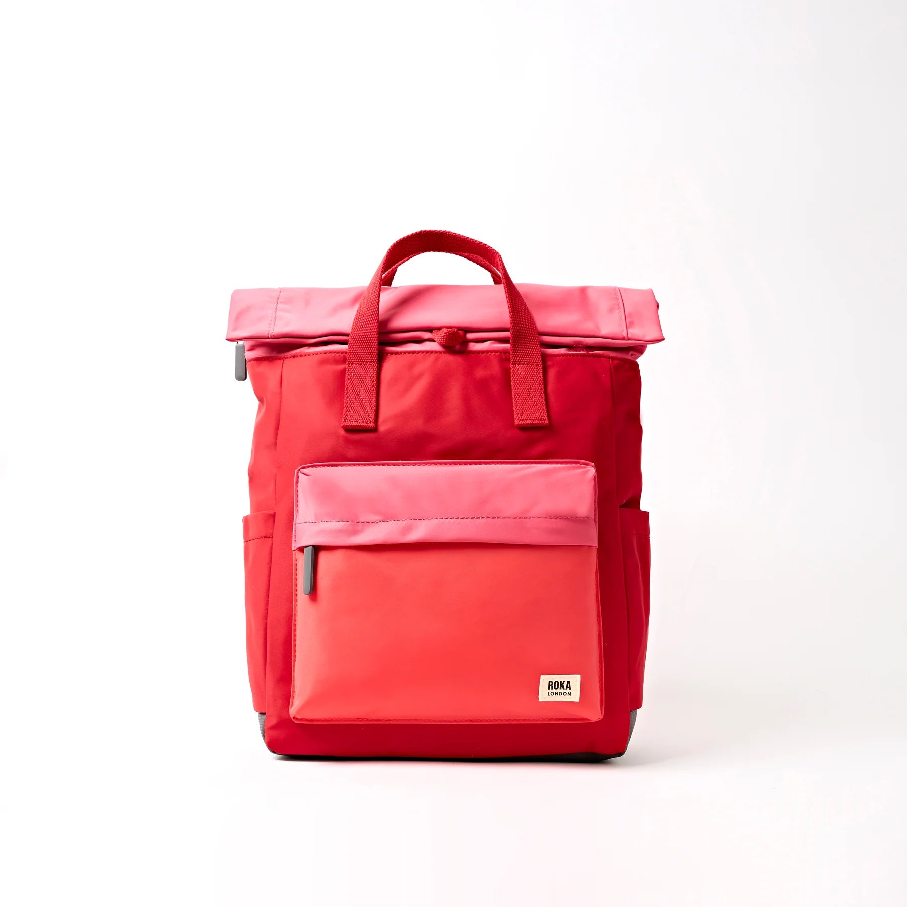Red backpack with a visible brand logo on a white background