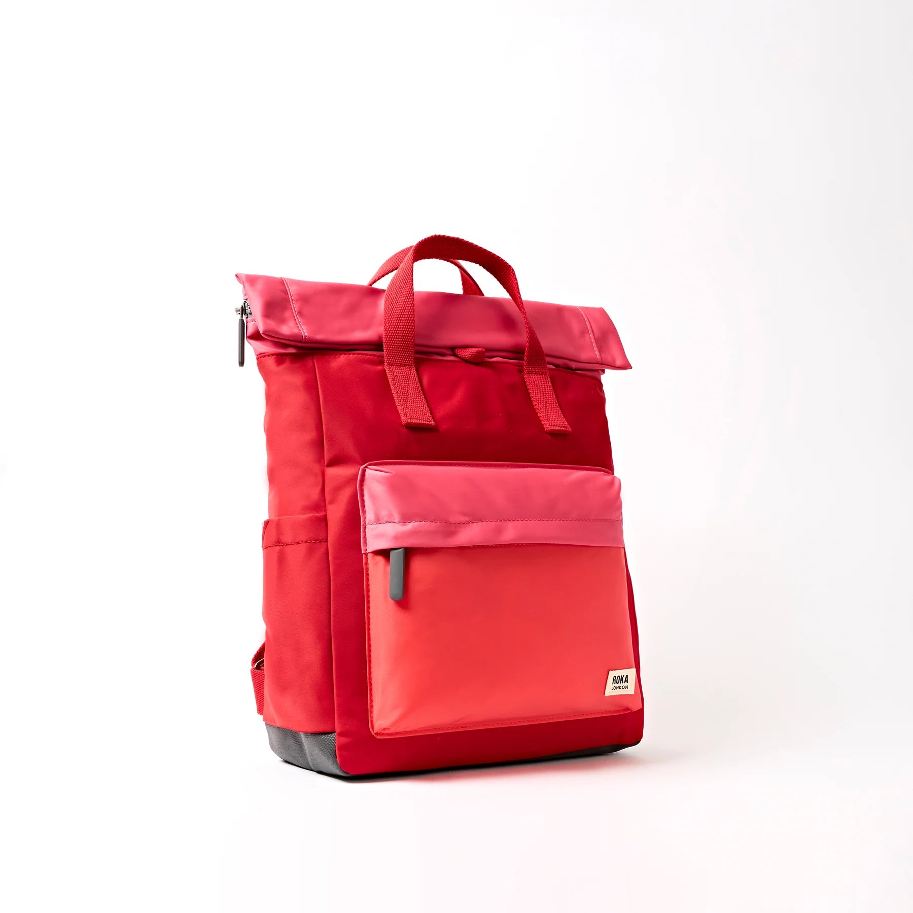 Red backpack on a white background