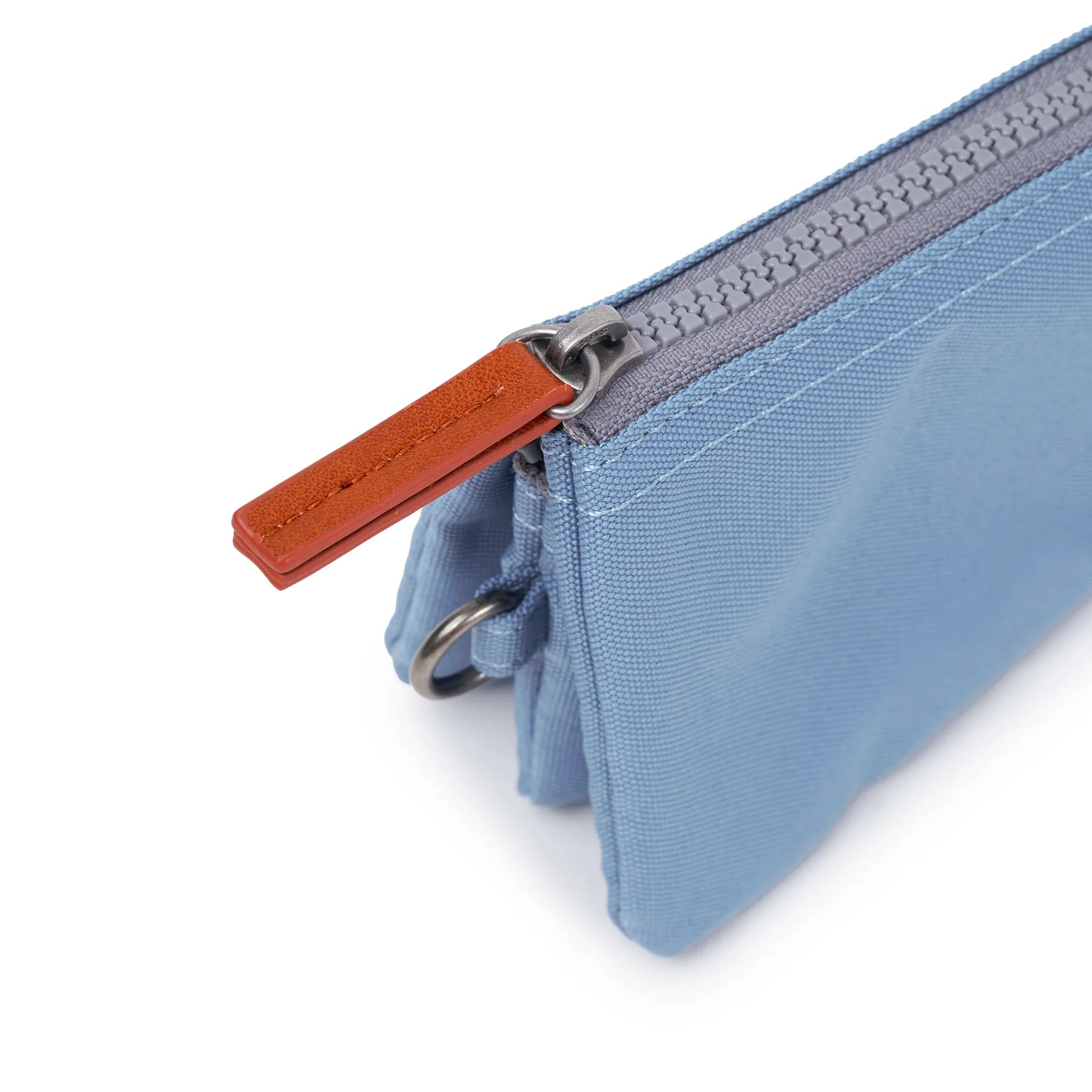 Blue zipper pouch with a brown zipper pull on a white background
