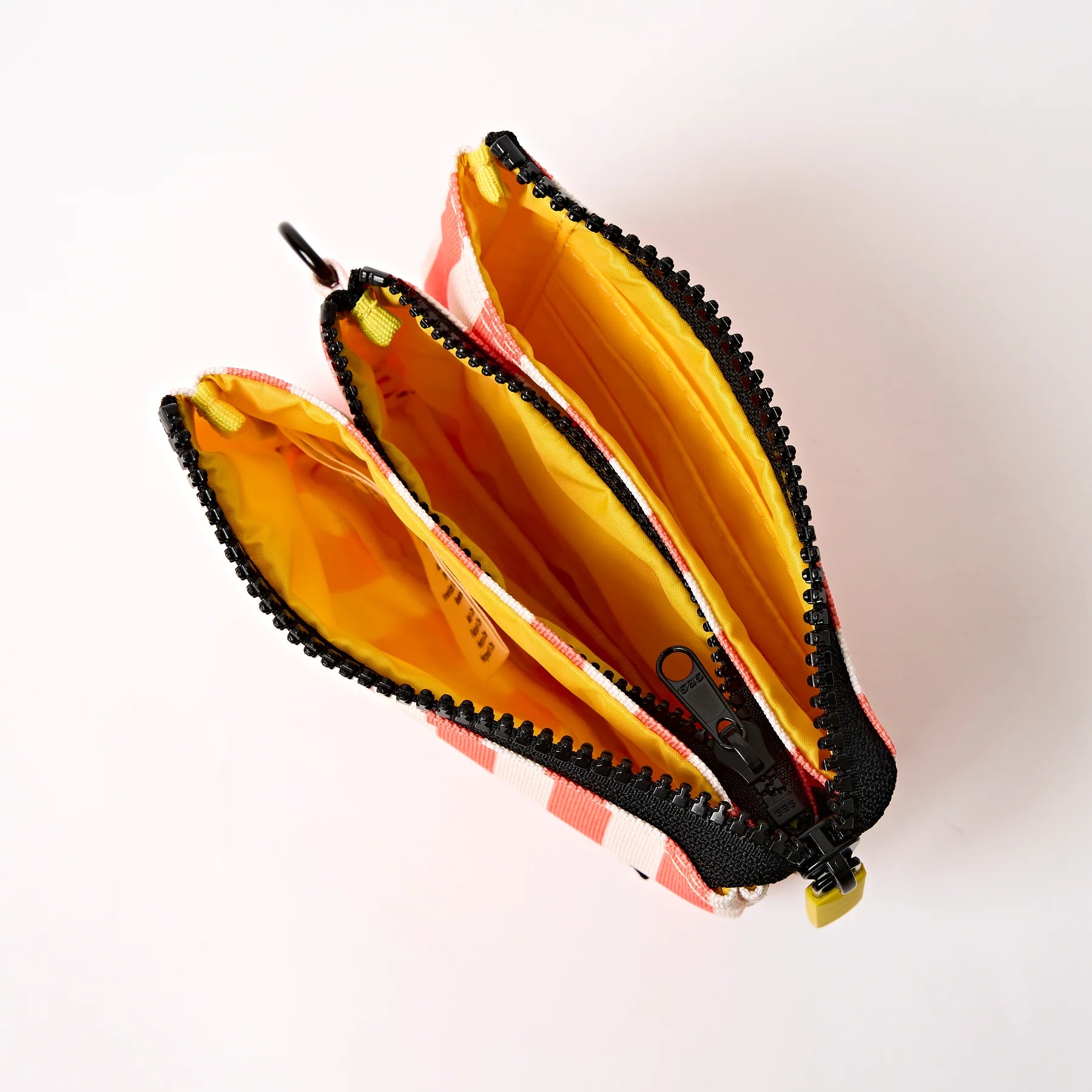 Open zipper pouch with colorful interior on a white background