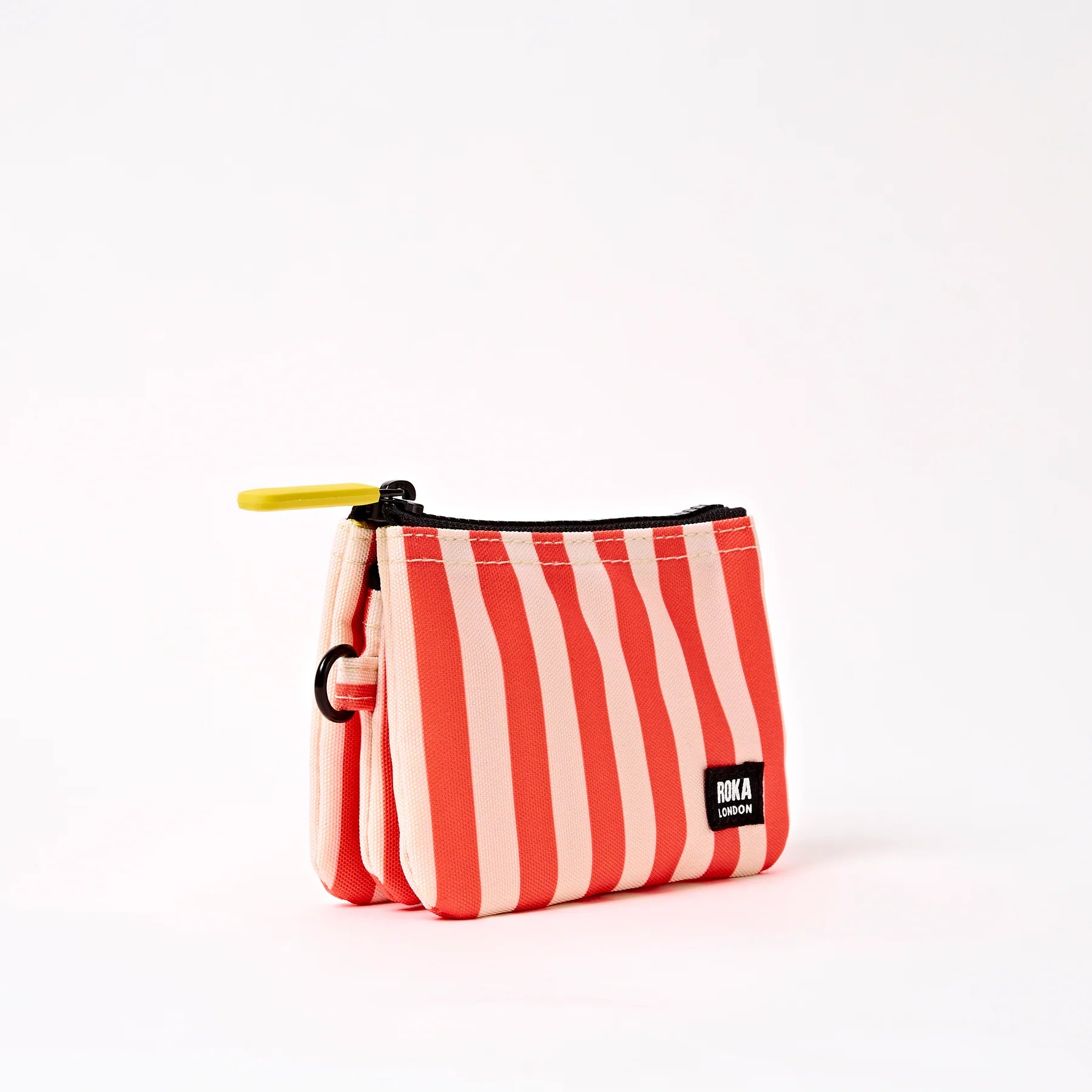 Red and white striped pouch with a black zipper on a white background