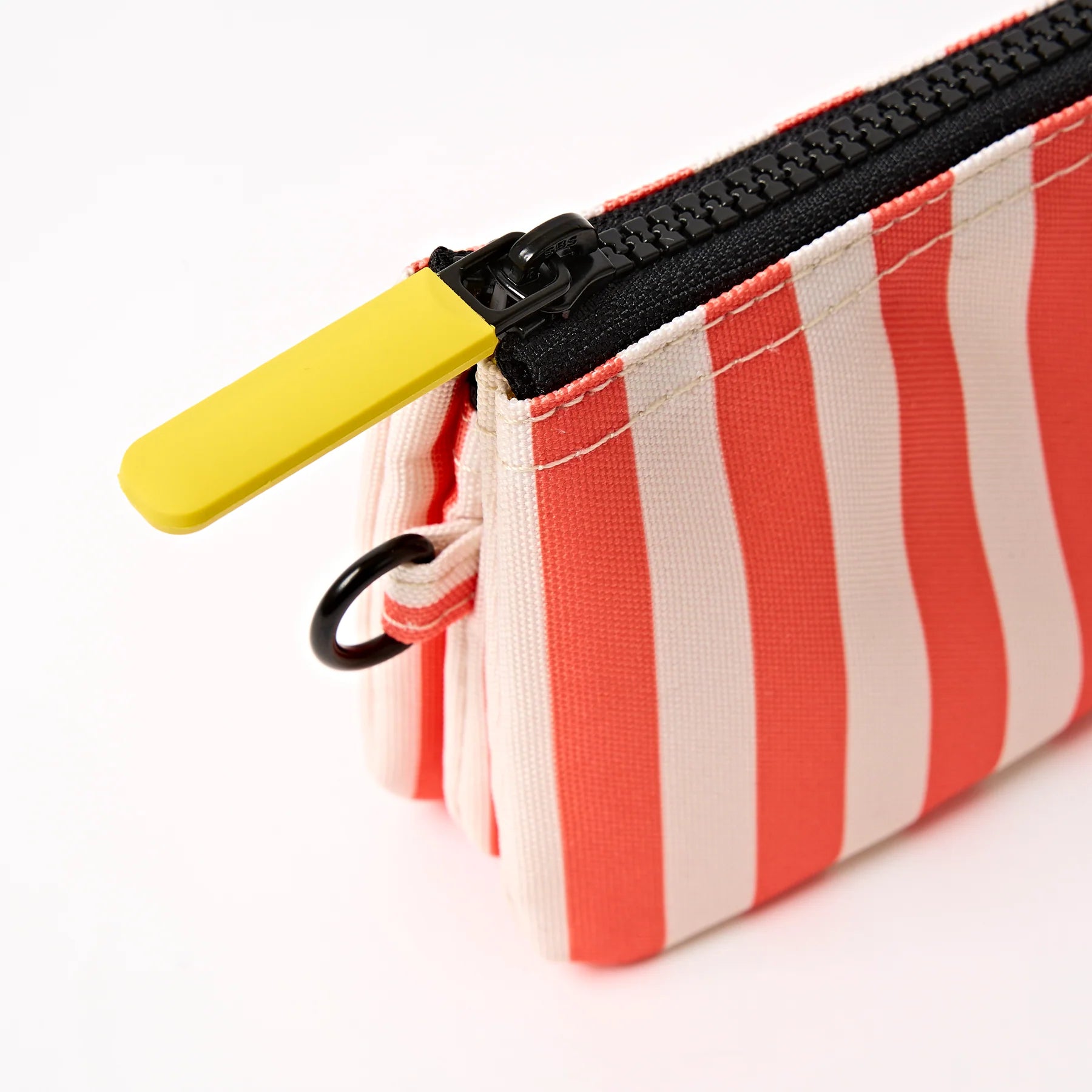 Striped pouch with a yellow pull tab on a white background
