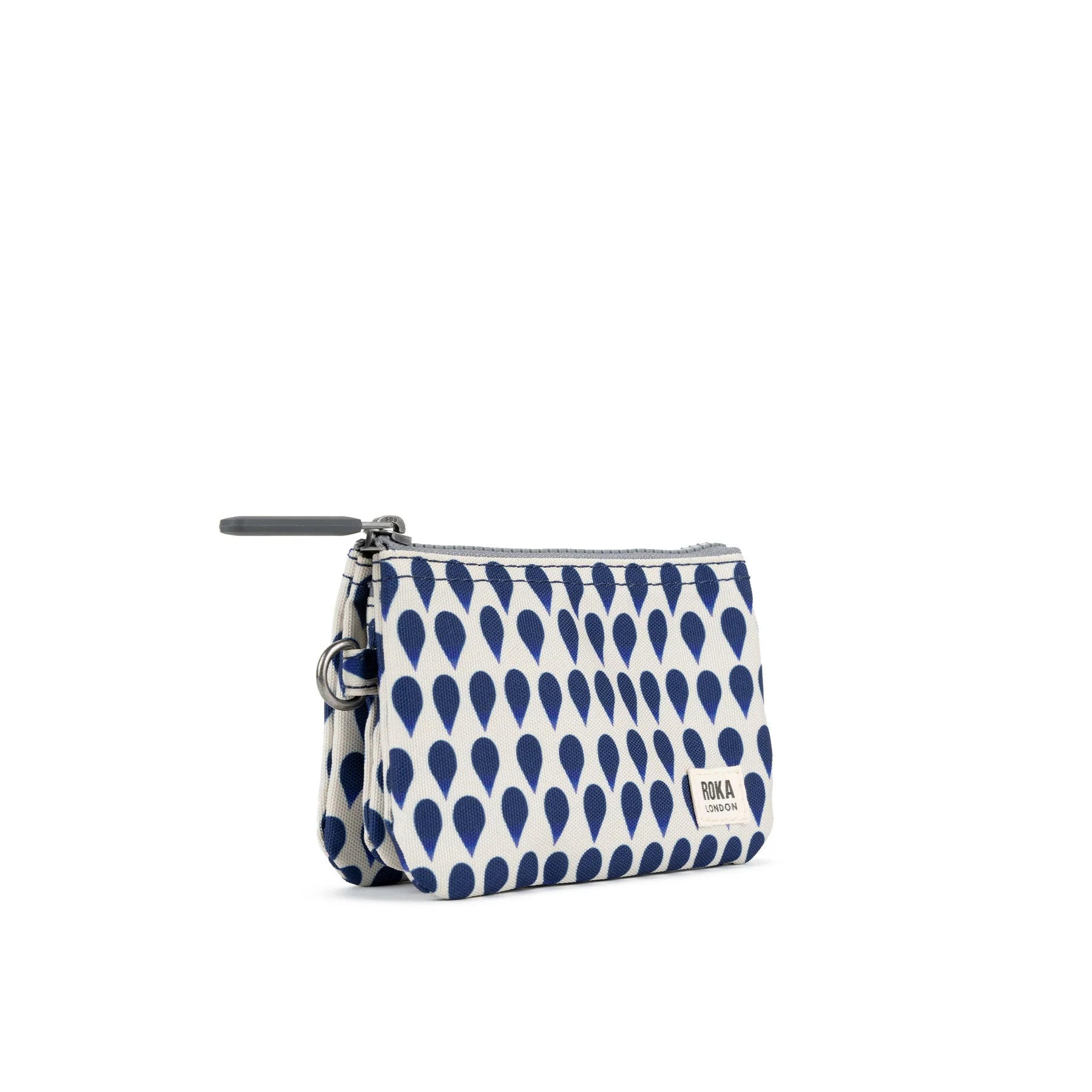 ROKA pouch featuring a navy teardrop pattern, with a zipper and keyring attachment. Stylish and practical accessory.