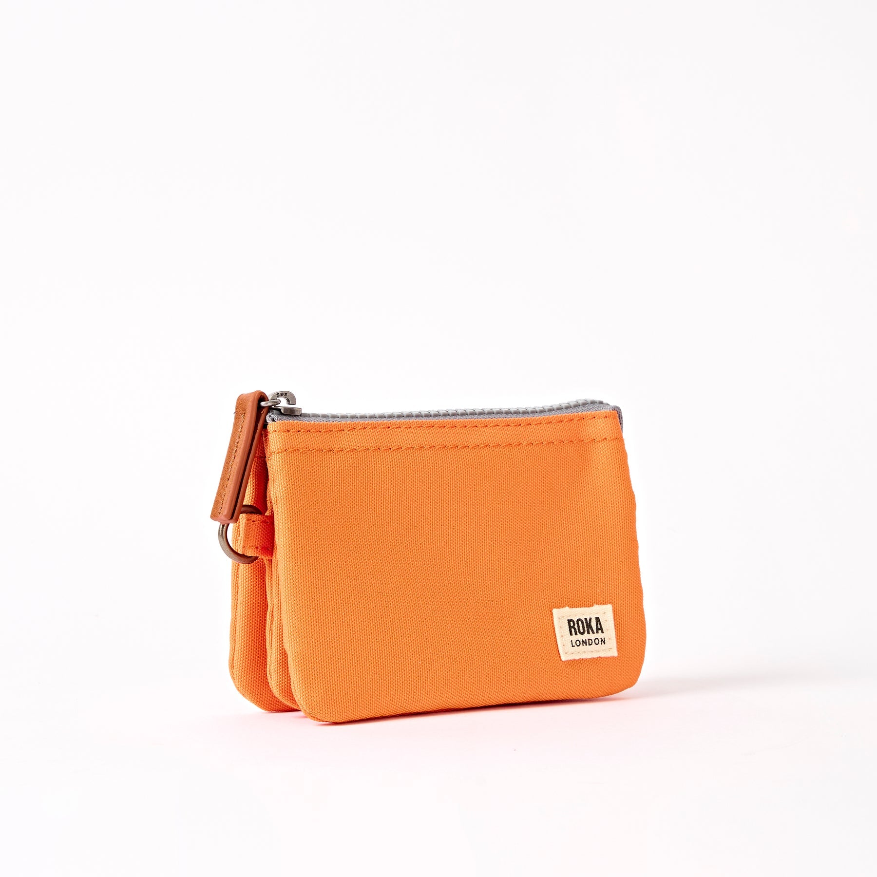 Orange wallet with a visible brand logo on a white background
