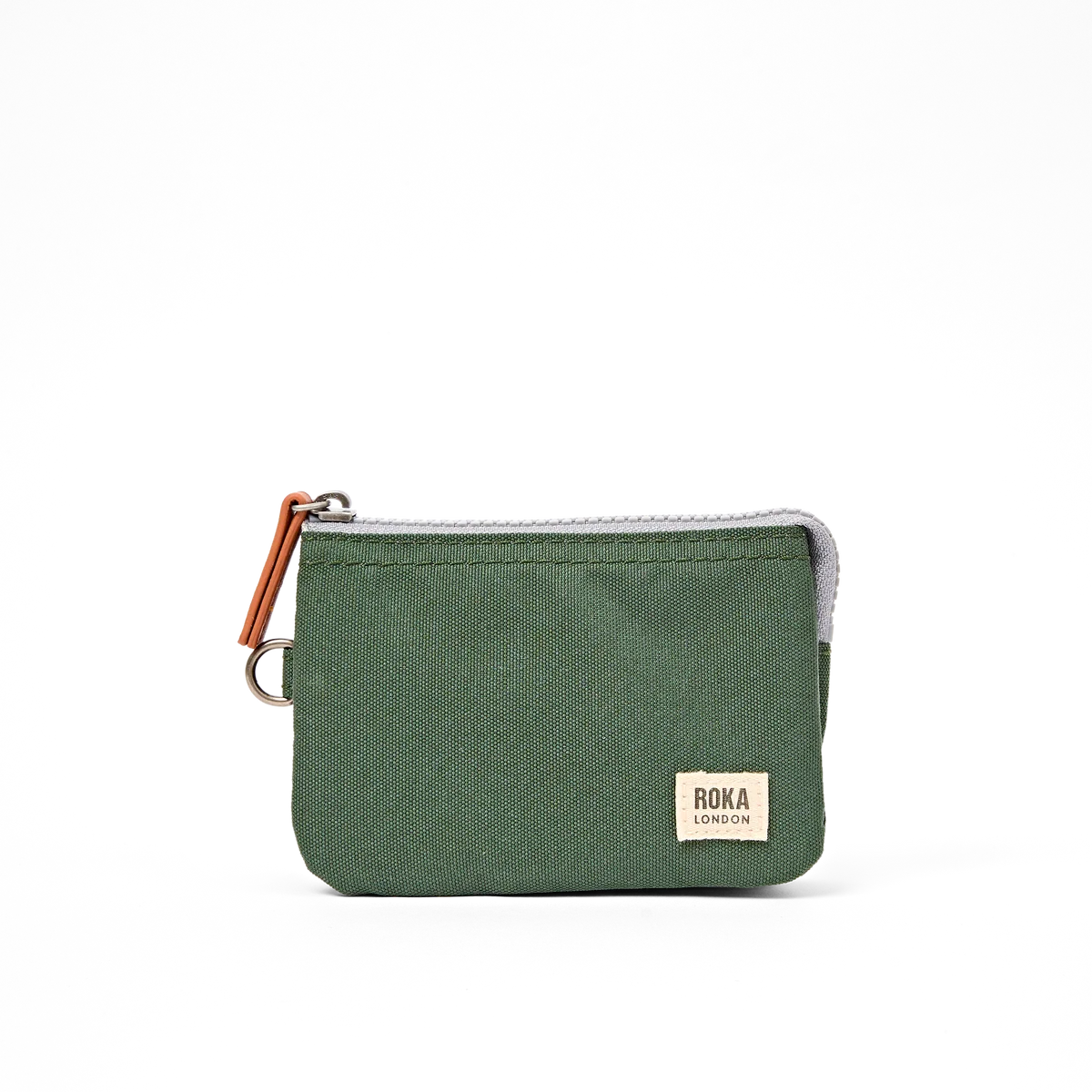 A small green canvas zip pouch wallet by ROKA LONDON, featuring a silver zipper, a brown leather pull tab, and a beige brand label on the front.