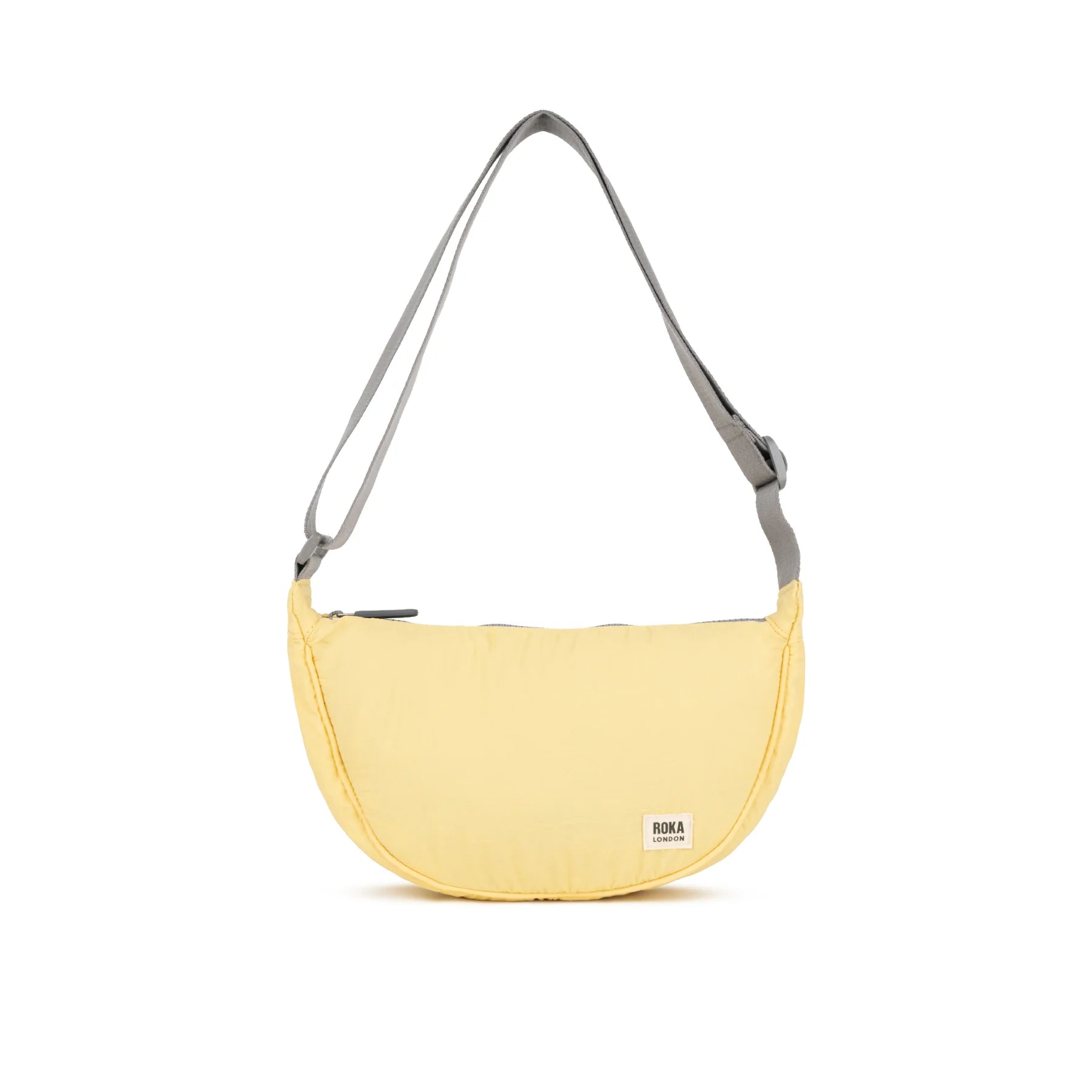 Yellow shoulder bag with a gray strap on a white background