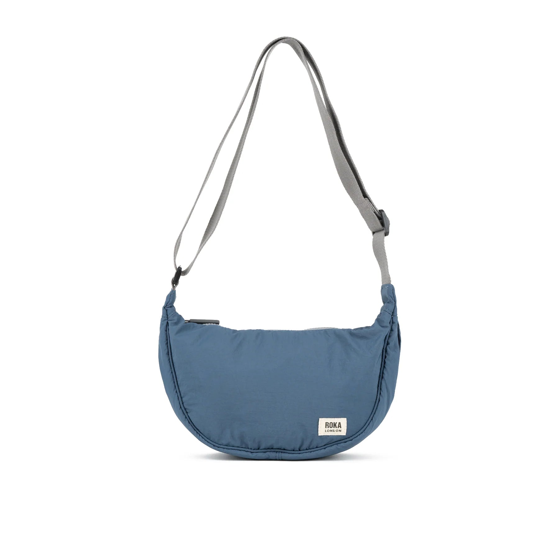Blue shoulder bag with a visible brand label on a white background
