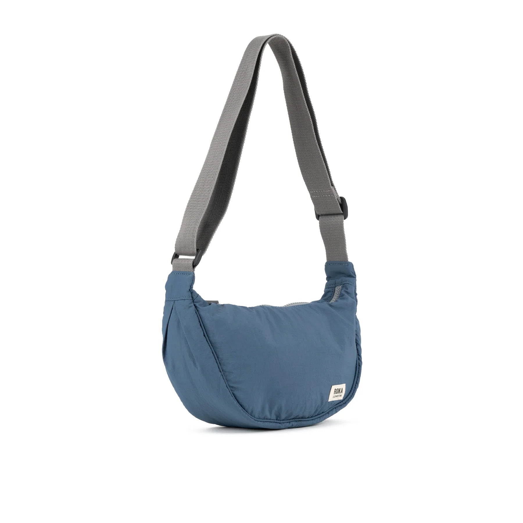 Blue shoulder bag with a visible brand label on a white background