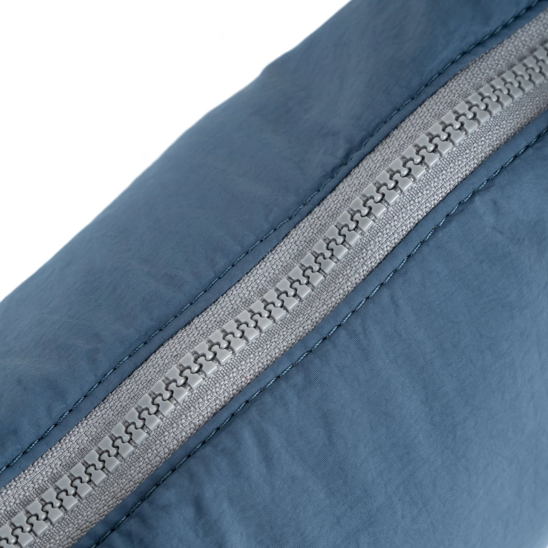 Blue shoulder bag with a visible brand label on a white background