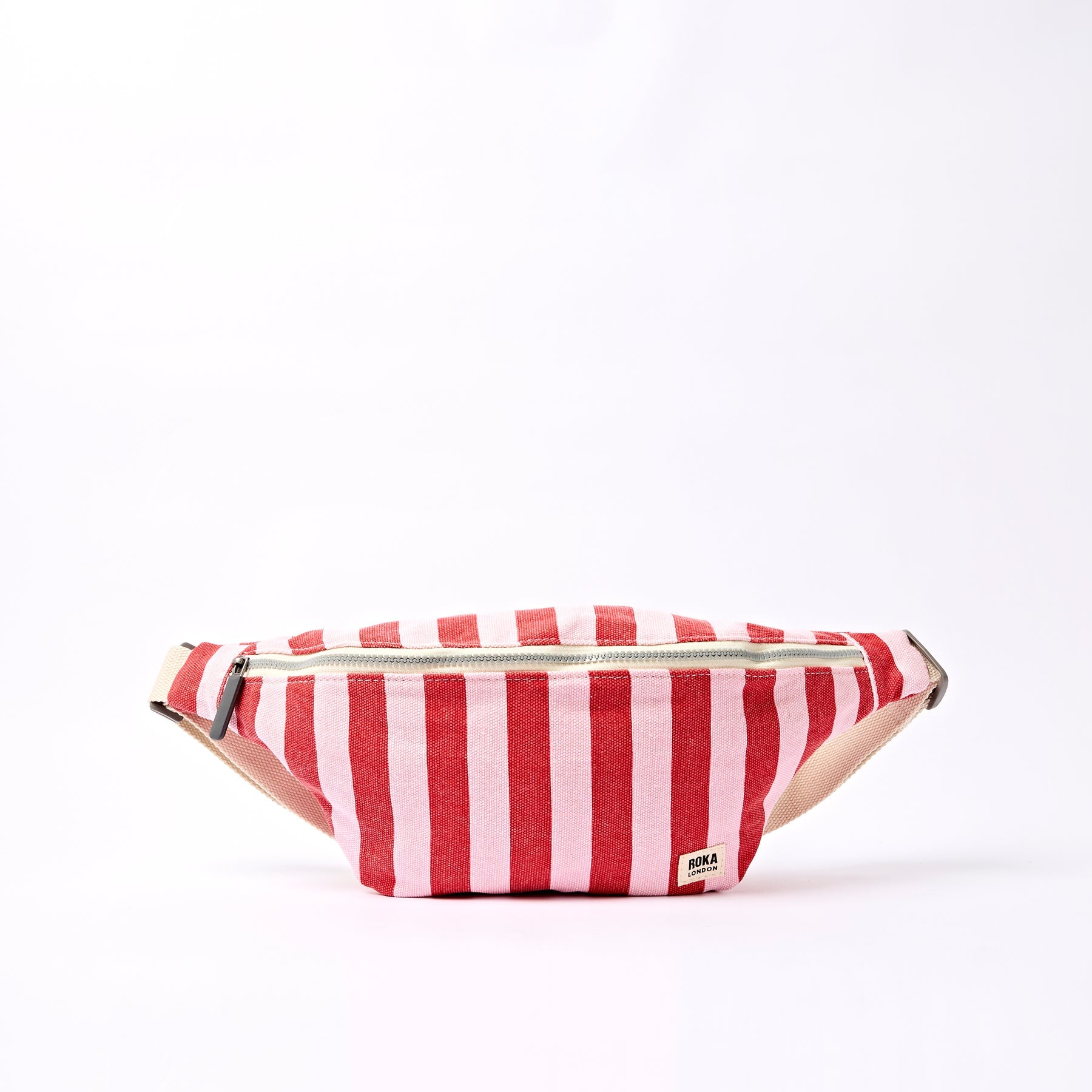 Red and white striped fanny pack on a white background