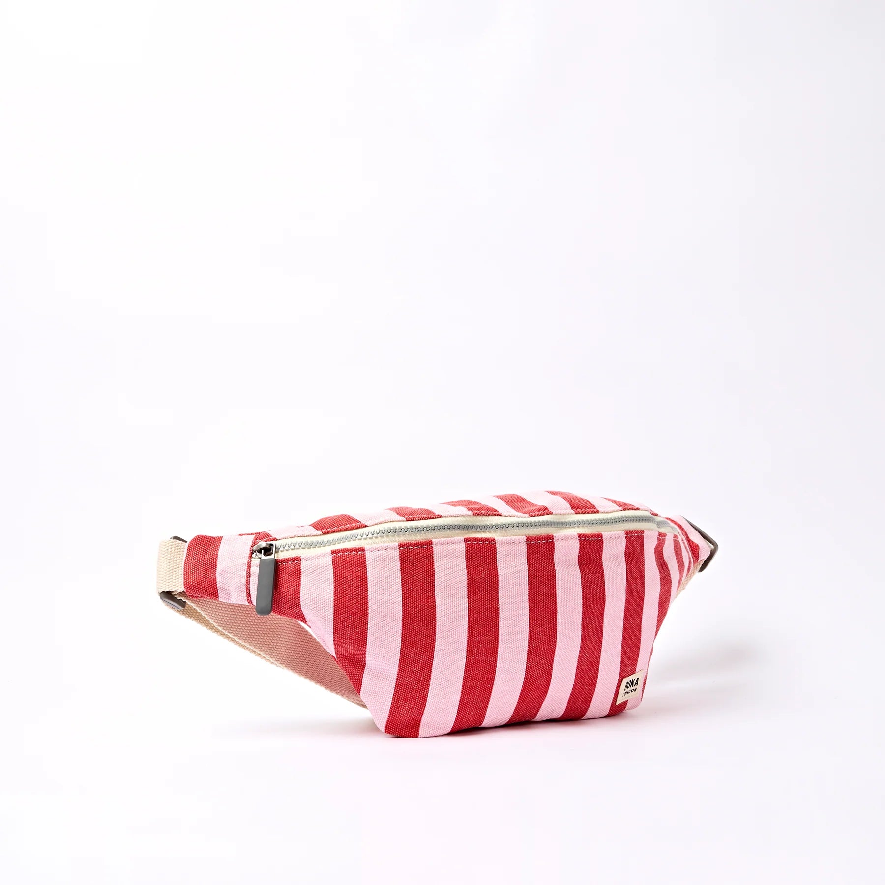 Red and white striped fanny pack on a white background