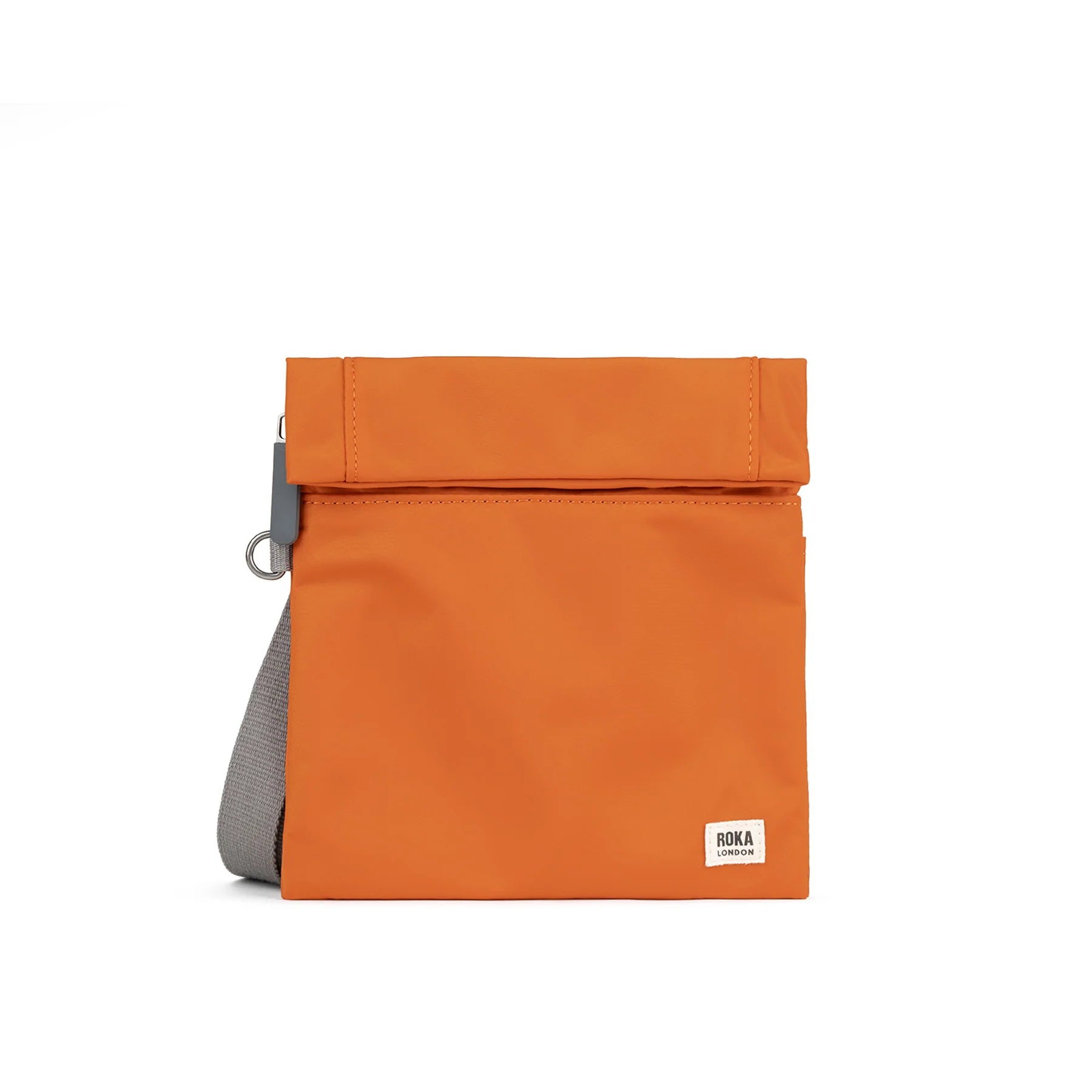 Orange ROKA bag with a fold-over top and gray strap, designed for a stylish, modern look.