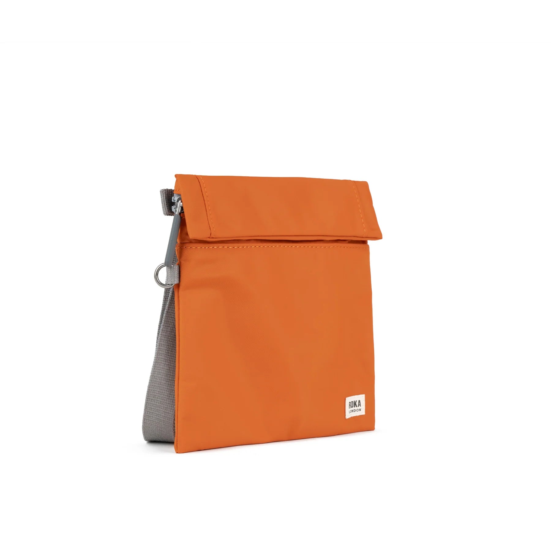 An orange fold-over bag with a gray base, featuring the ROKA logo on the front.