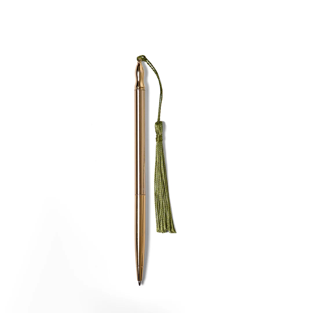 Gold pen with a green tassel on a white background