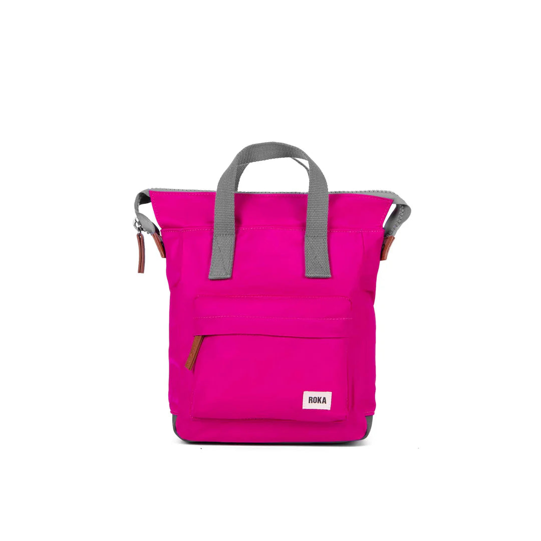 Pink Roka backpack with gray handles and small front pocket.