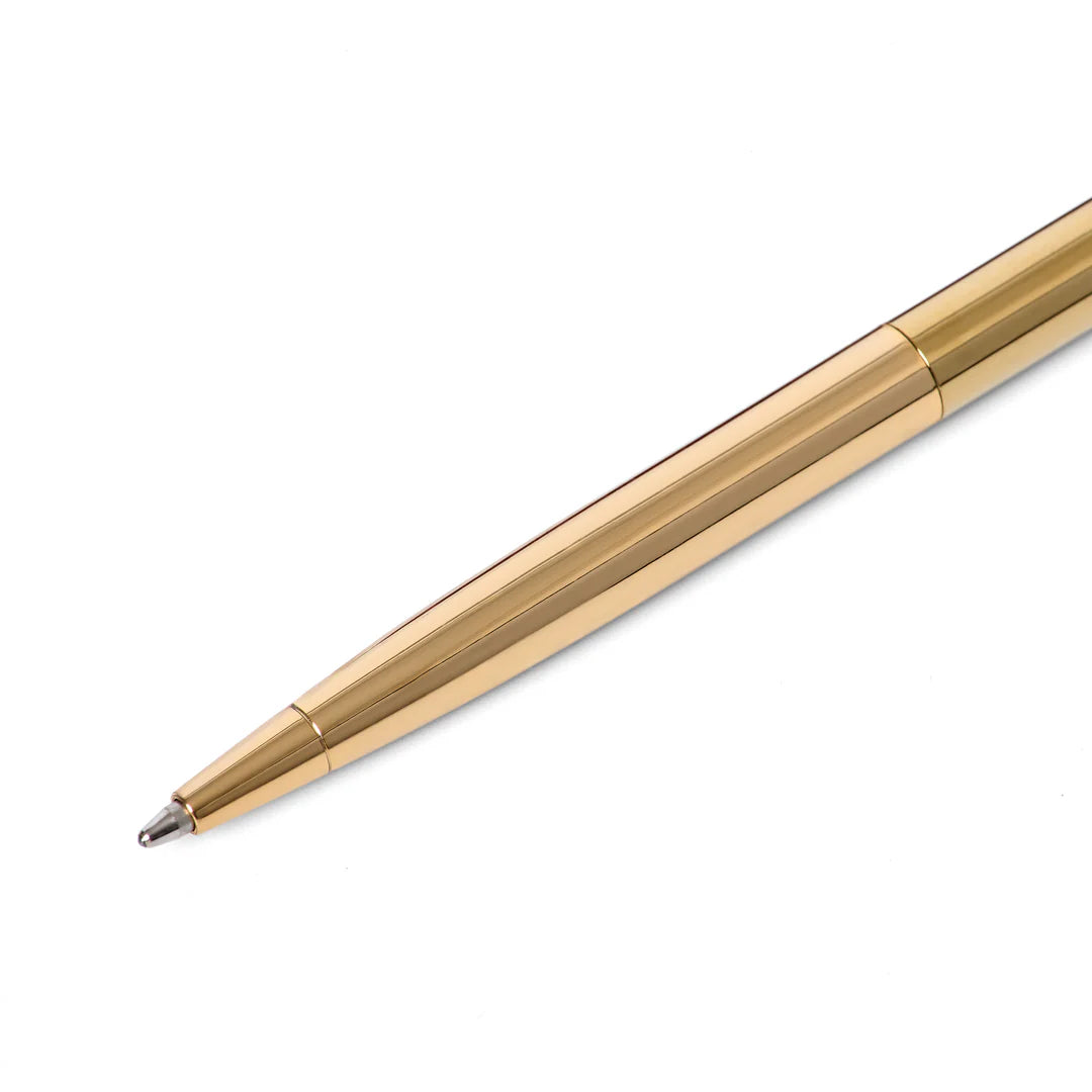 Gold pen on a white background