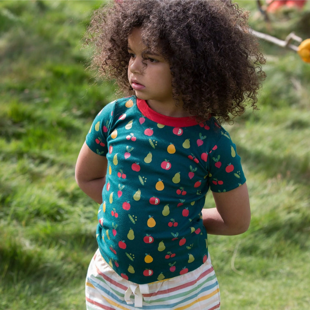 Child's teal short-sleeved t-shirt with a fruit and vegetable print.