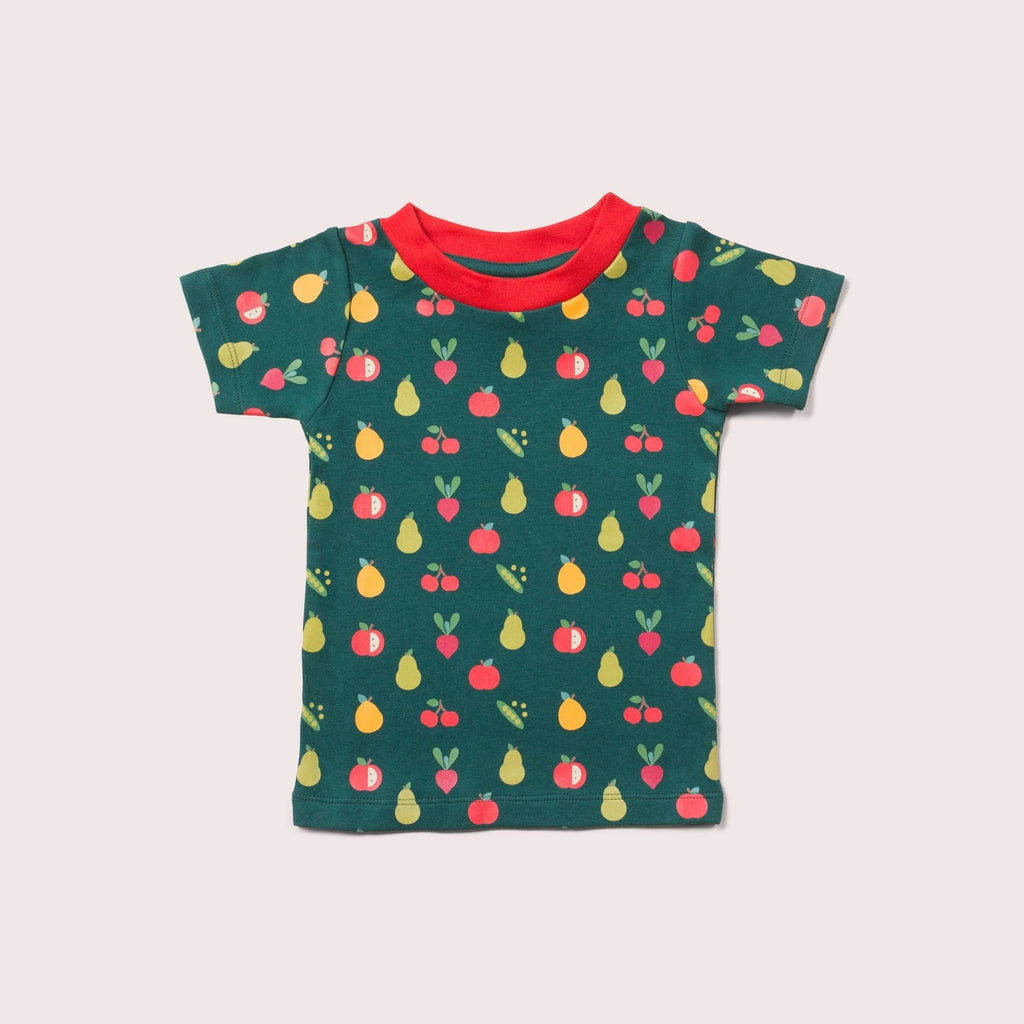 Green toddler t-shirt with a colorful fruit and vegetable print.  Features a red neckline.