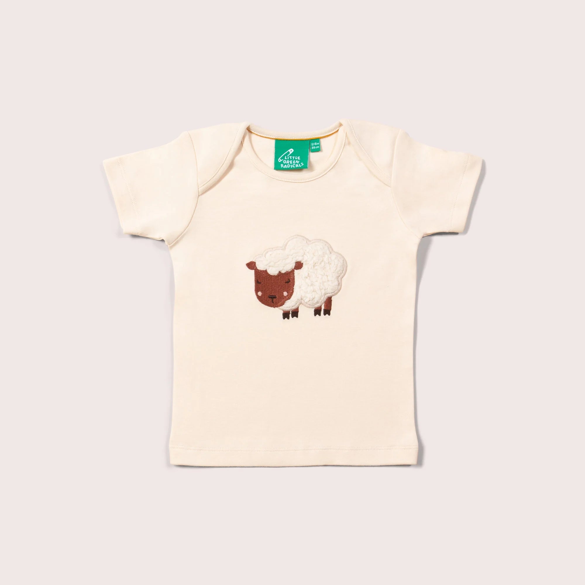 Cream-colored baby onesie with short sleeves, featuring an embroidered sheep design on the front.