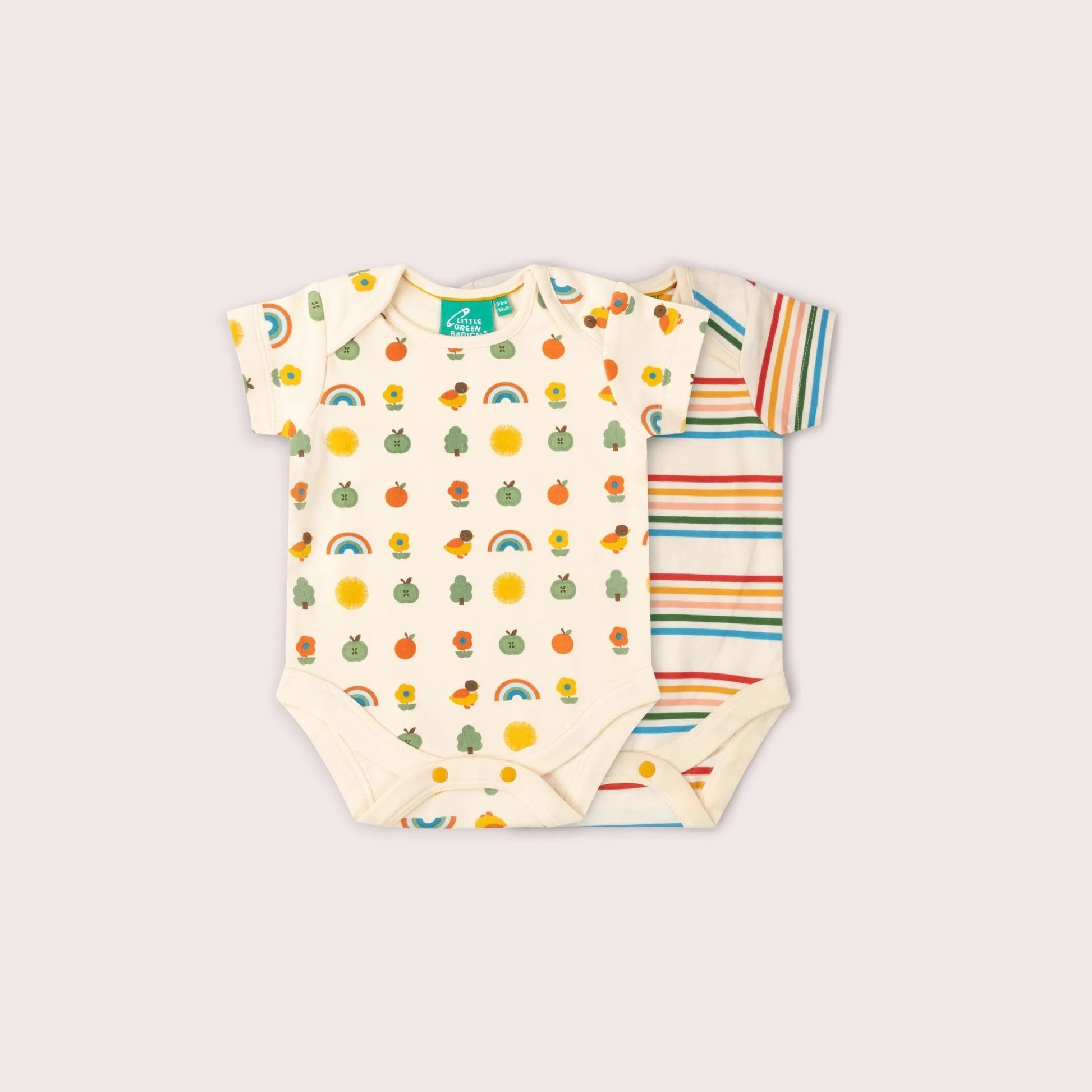 Two baby bodysuits with colorful patterns on a light gray background