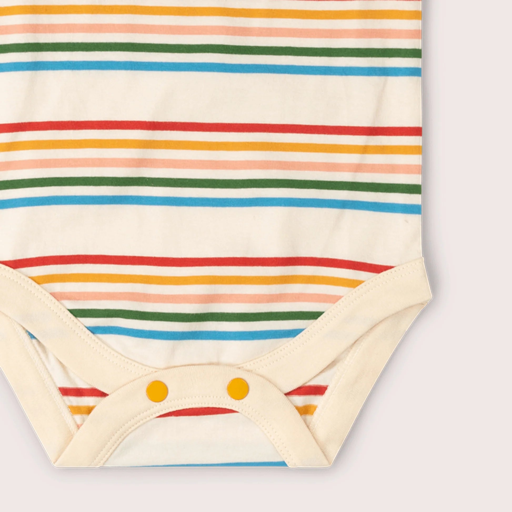 Baby onesie with rainbow stripes on a white background