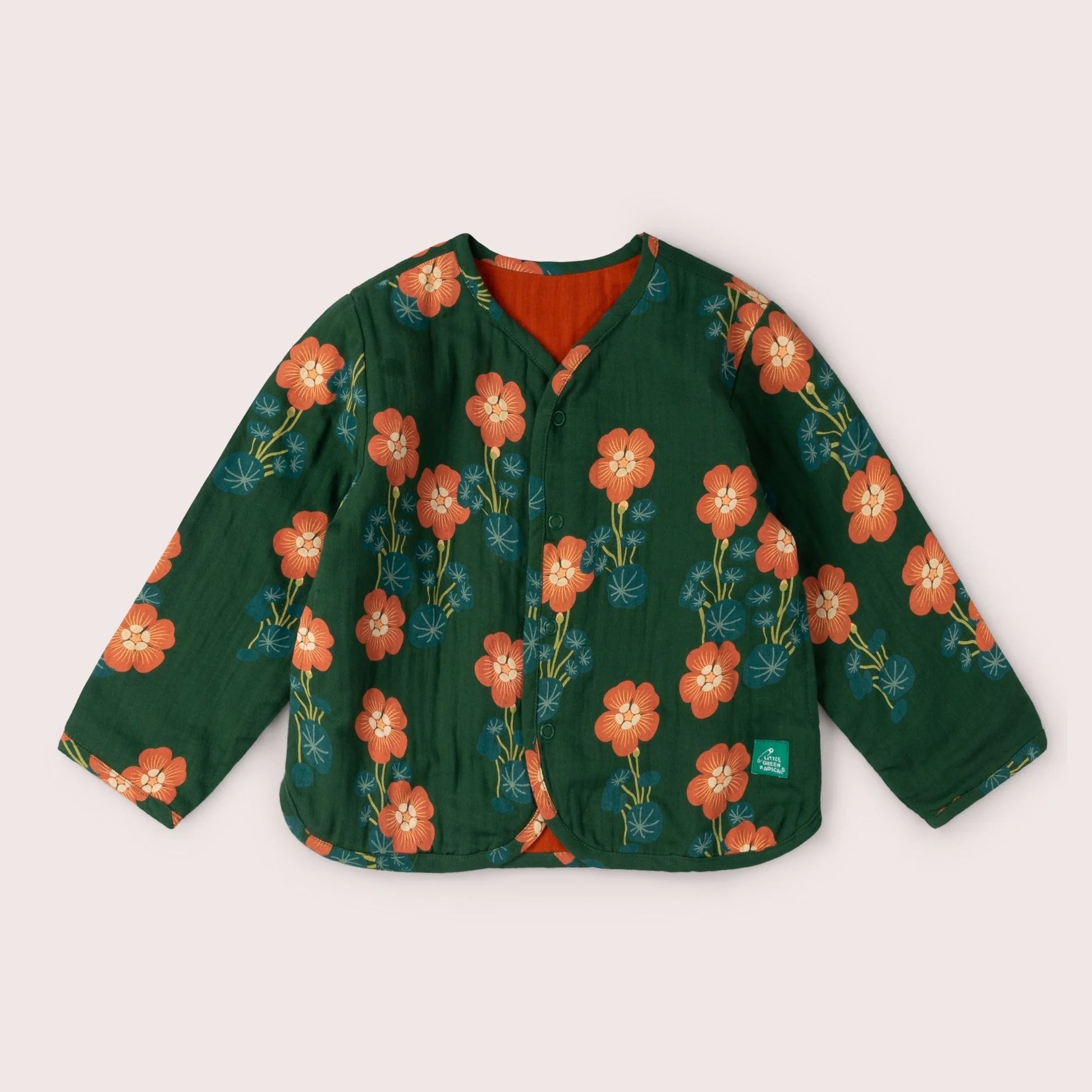 Green jacket with orange floral pattern on a light gray background